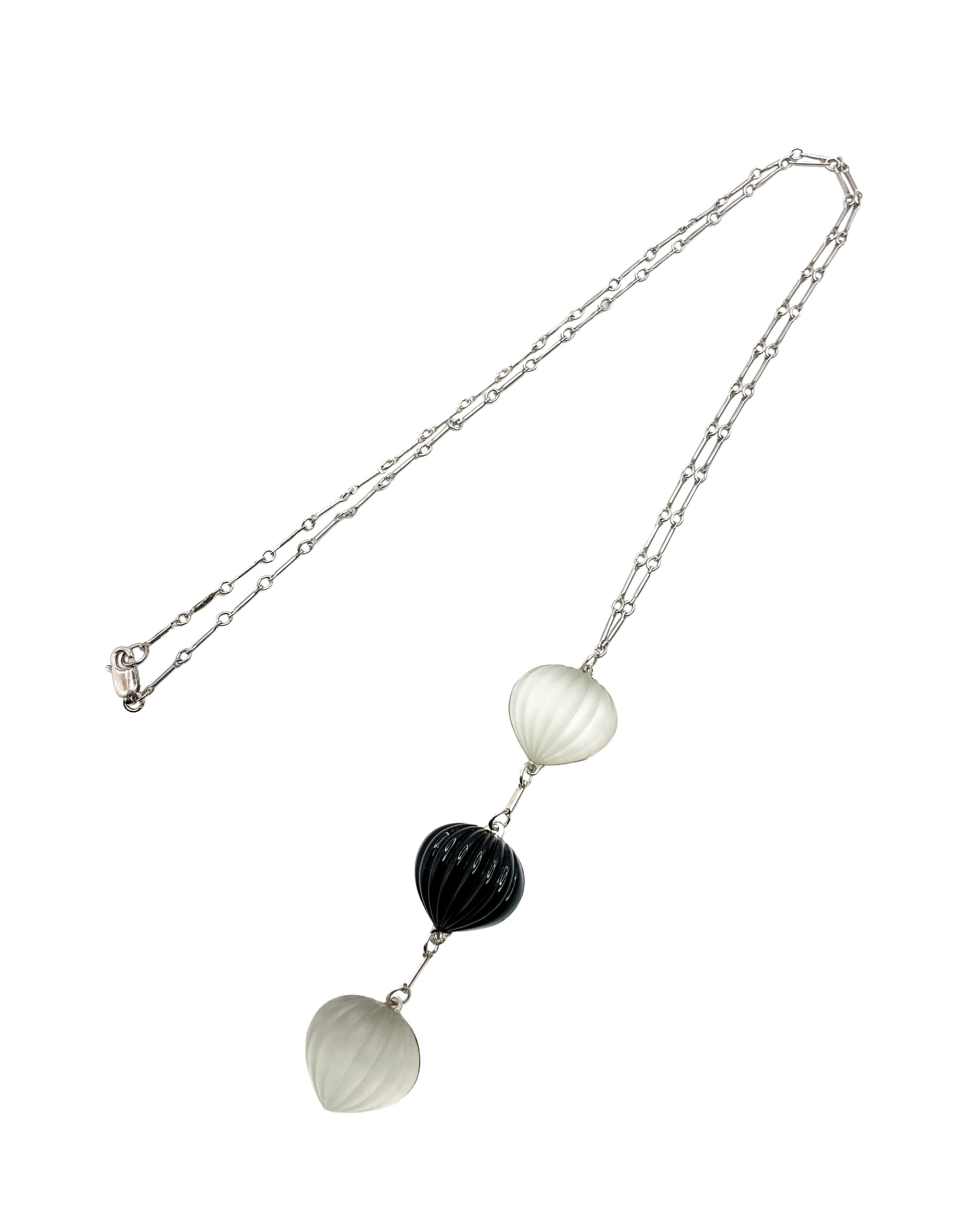 This elegant Y-necklace features three ribbed briollette glass pendants. They are lined with sterling silver and separated by chain in a drop style. The vintage glass is from Czech Republic. Two of the broillette drops are frosted clear, separated
