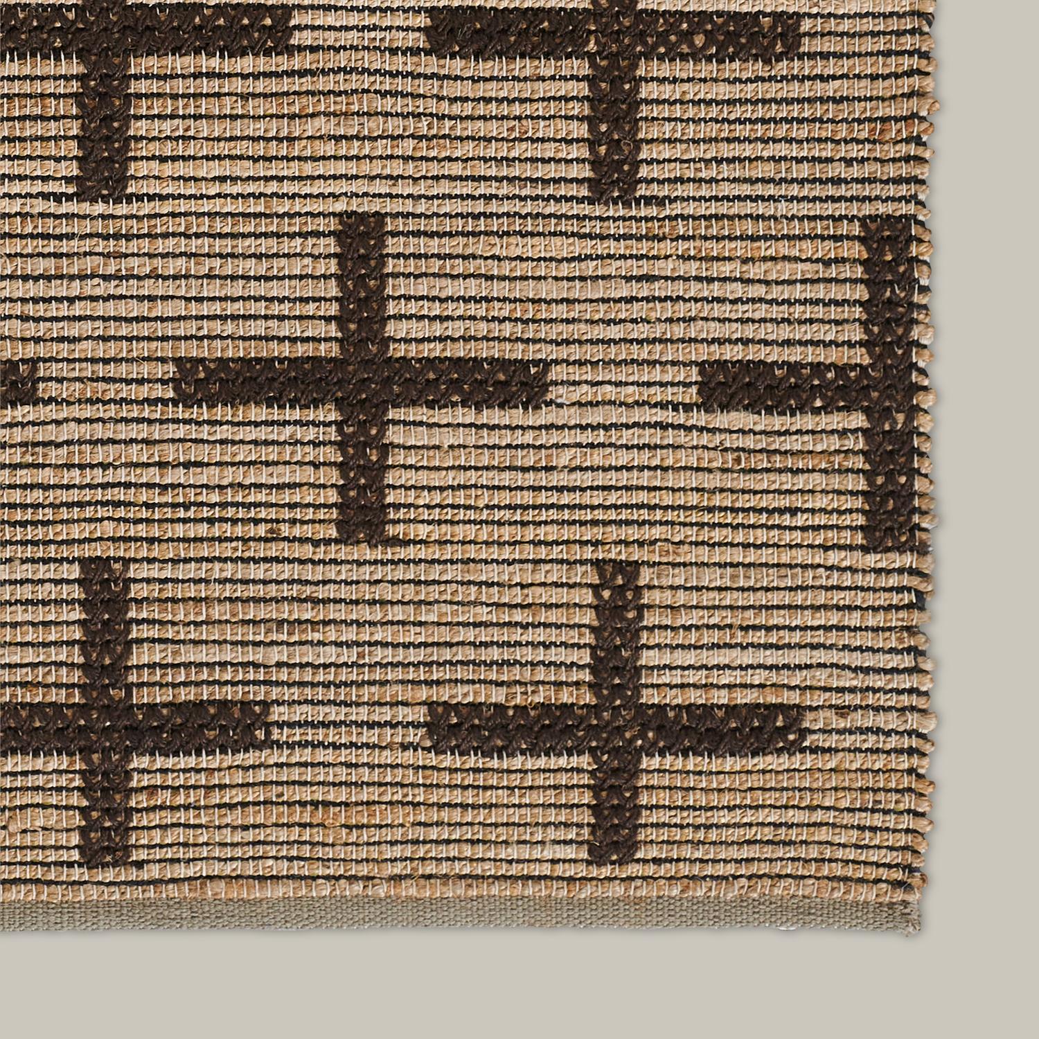 The Pontoise collection offers a modern, organic aesthetic with a bit of graphic appeal. Woven entirely by hand using 100% jute fibers, a special top-stitching embroidery technique is applied over a flat-weave base, giving these rugs beautiful