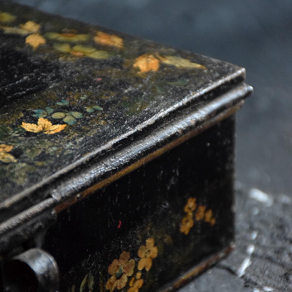 Pontypool lacquered English spice box Circa 1850 
We are proud to offer a mid-19th century English toleware spice box, decorated around the box with a highly decorative floral pattern, opening to reveal individual handwritten spice labels to the