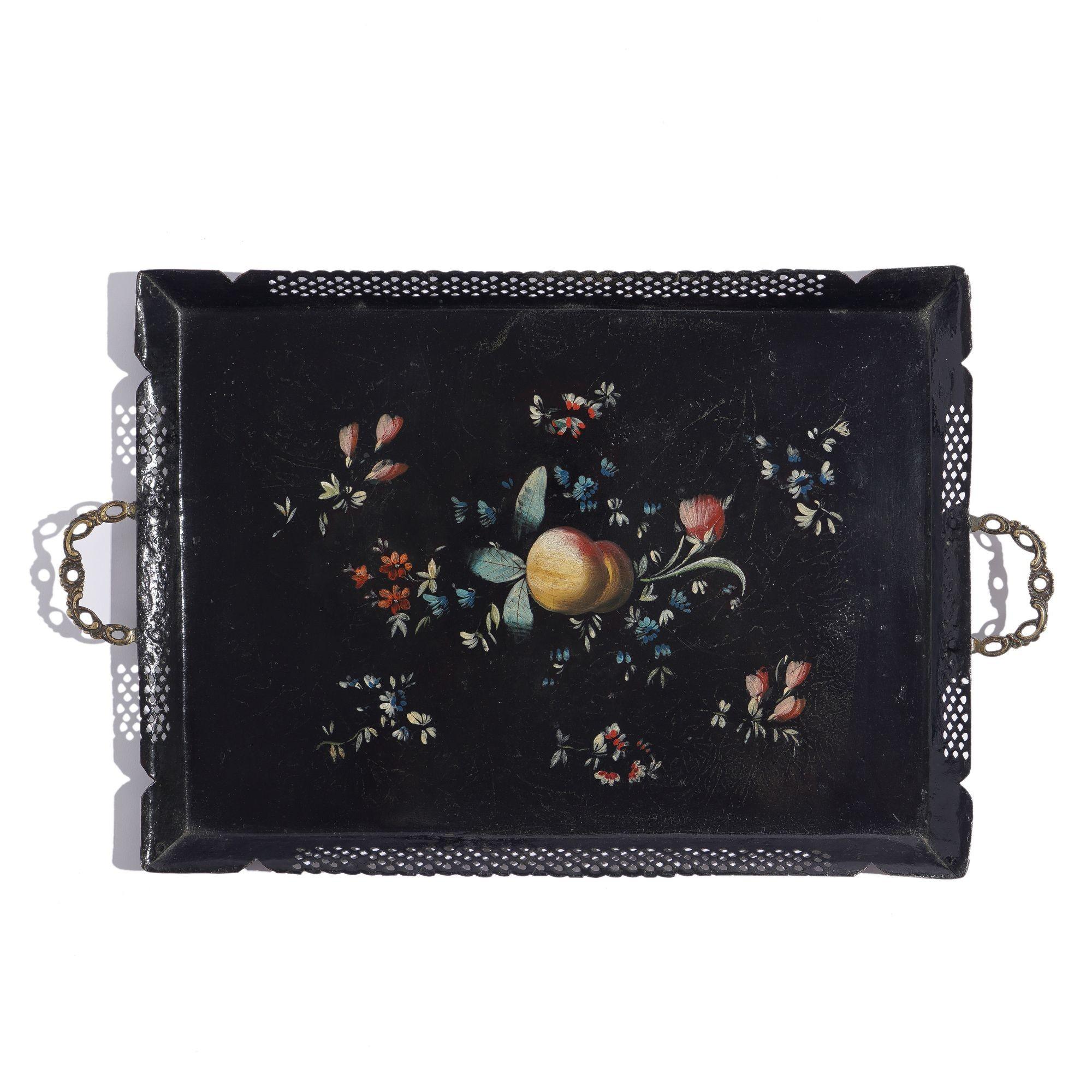Tole tea tray with reticulated standing rim and applied cast brass handles. The tray is decorated by hand in polychrome enamels with scattered fruit & flowers.
Pontypool, Wales, circa 1780.