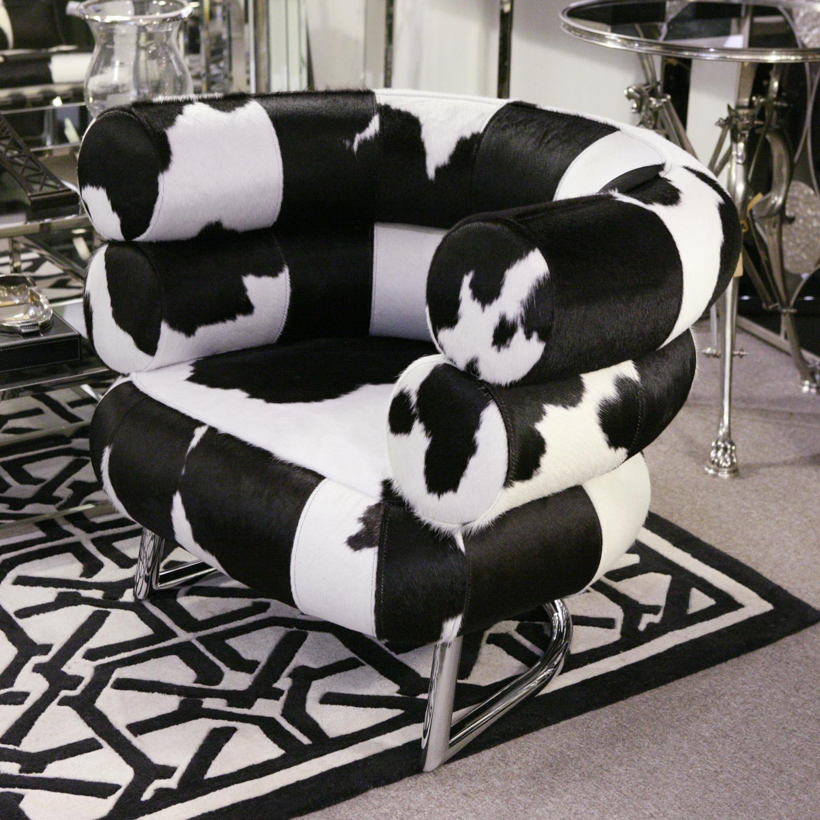 Pony Bibendum 1 armchair black and white,
covered with treated natural cowhide,
on polished stainless steel base.
Exceptional piece.