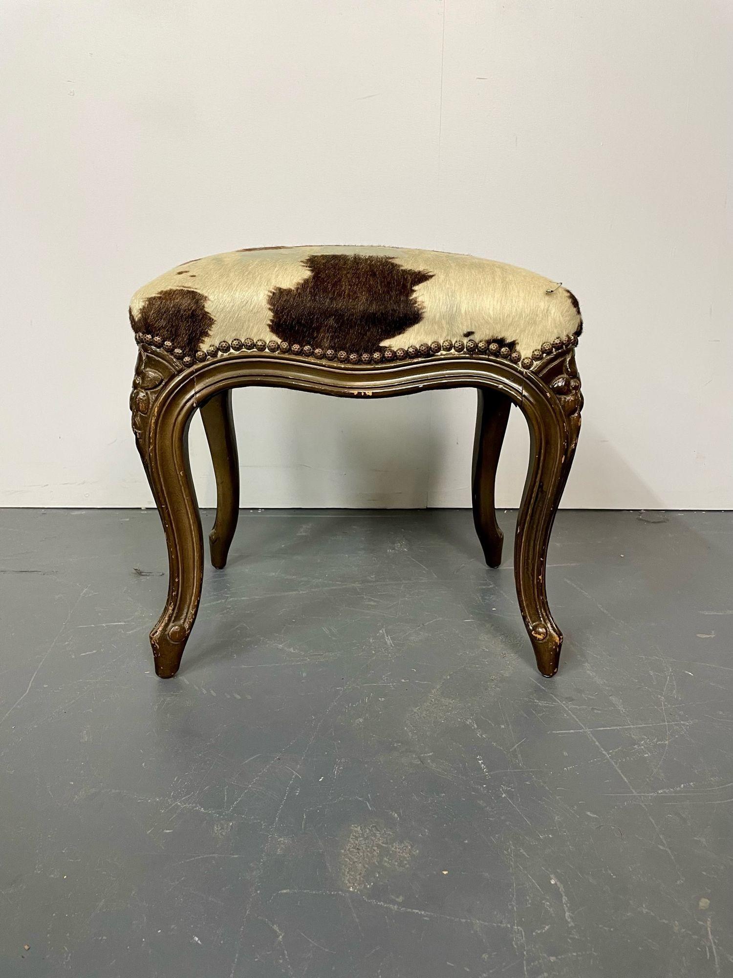 Pony Skin upholstered, wooden foot stool with brass tack detailing
A Louis XV Style Footstool or Bench having carved walnut legs with a recently upholstered pony skin top. 
17.5H x 17W x 13.5D.