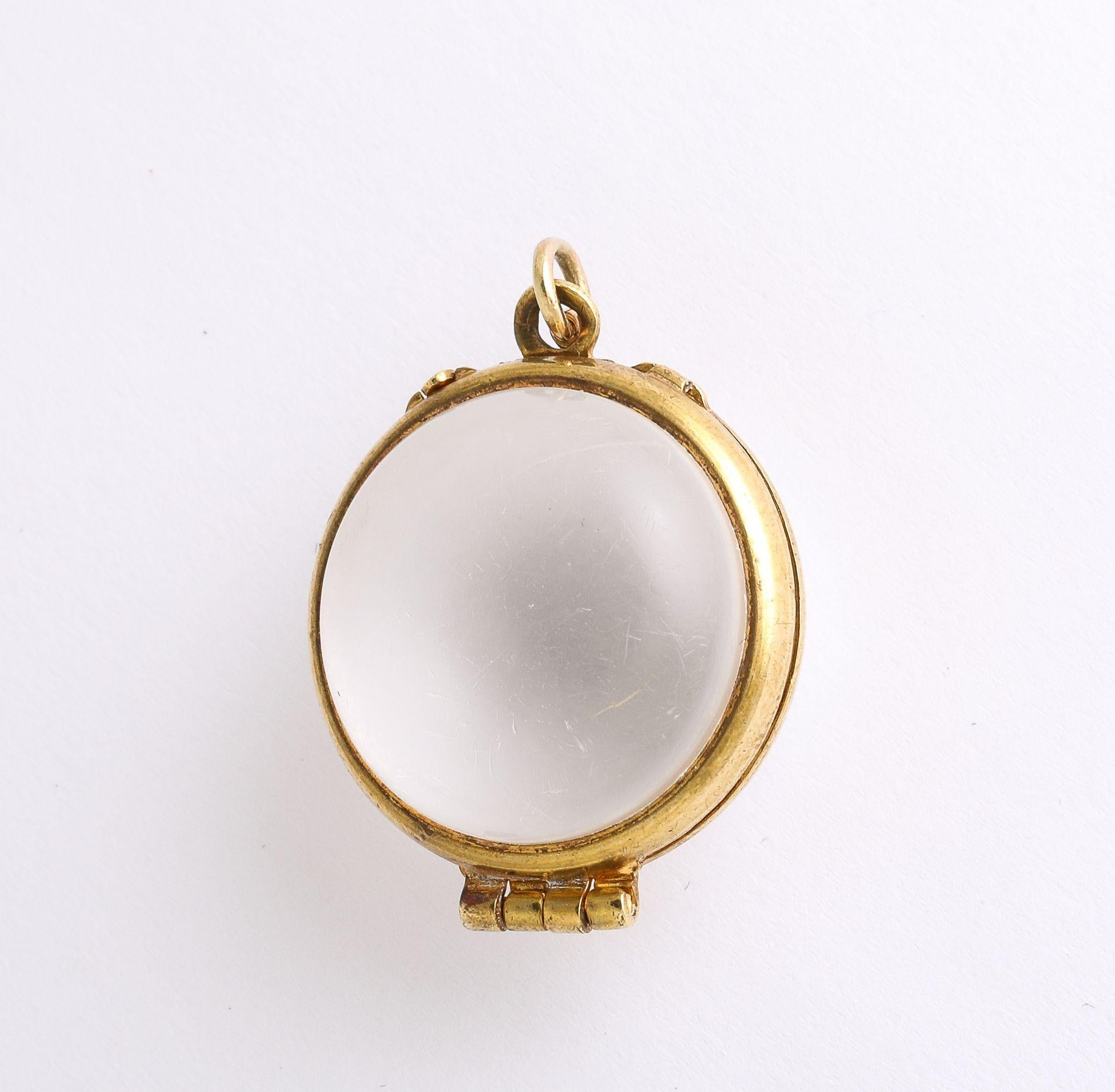 A great antique 'Pool of Light' locket in rock crystal and 18K gold. This locket can be also purchased with floating diamonds if you wish.  It looks wonderful as a fob on a watch chain necklace.