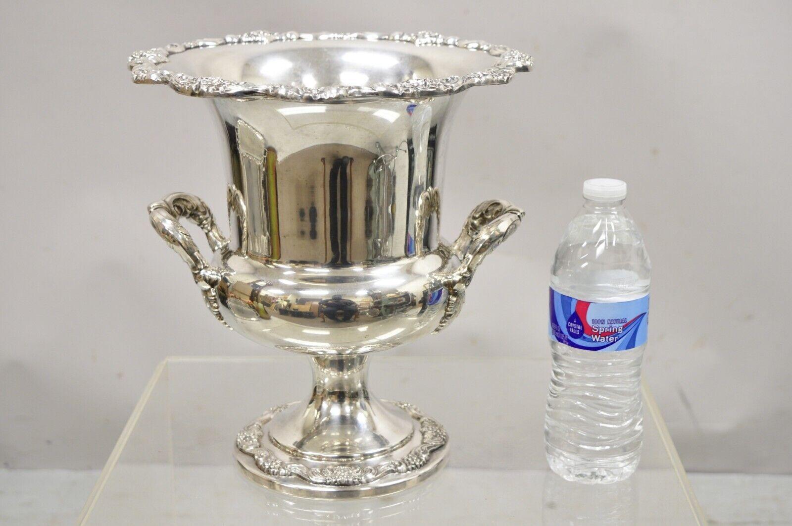 Poole English Regency silverplate trophy cup urn champagne wine chiller bucket. Item features removable liner, ornate twin handles, floral decorated rim and base, stamp to underside, 