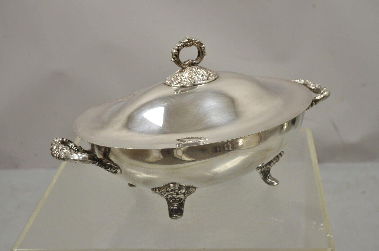 Poole Epca Lancaster Silver Plate Lidded Regency Style Soup Tureen serving bowl. raised on ornate feet, ornate twin handles, lid with spoon cut out, original stamp, very nice vintage item. Circa mid 20th century. Measurements: 9