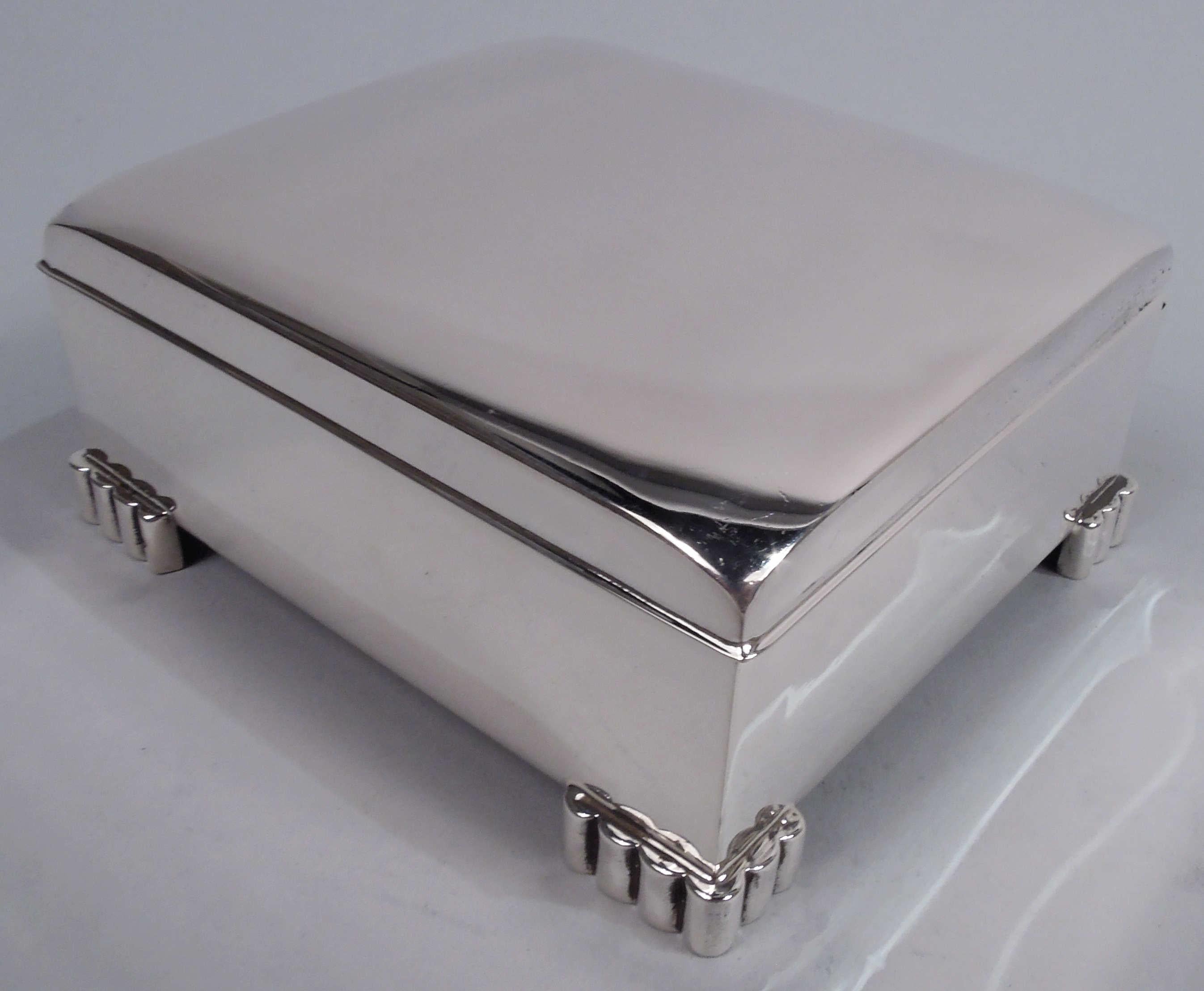Midcentury Modern sterling silver box. Made by Poole in Taunton, Mass. Rectangular with straight sides. Cover hinged with curved top. Cast corner bracket supports in form of Classical colonnade. Box interior cedar lined. Open leather-lined