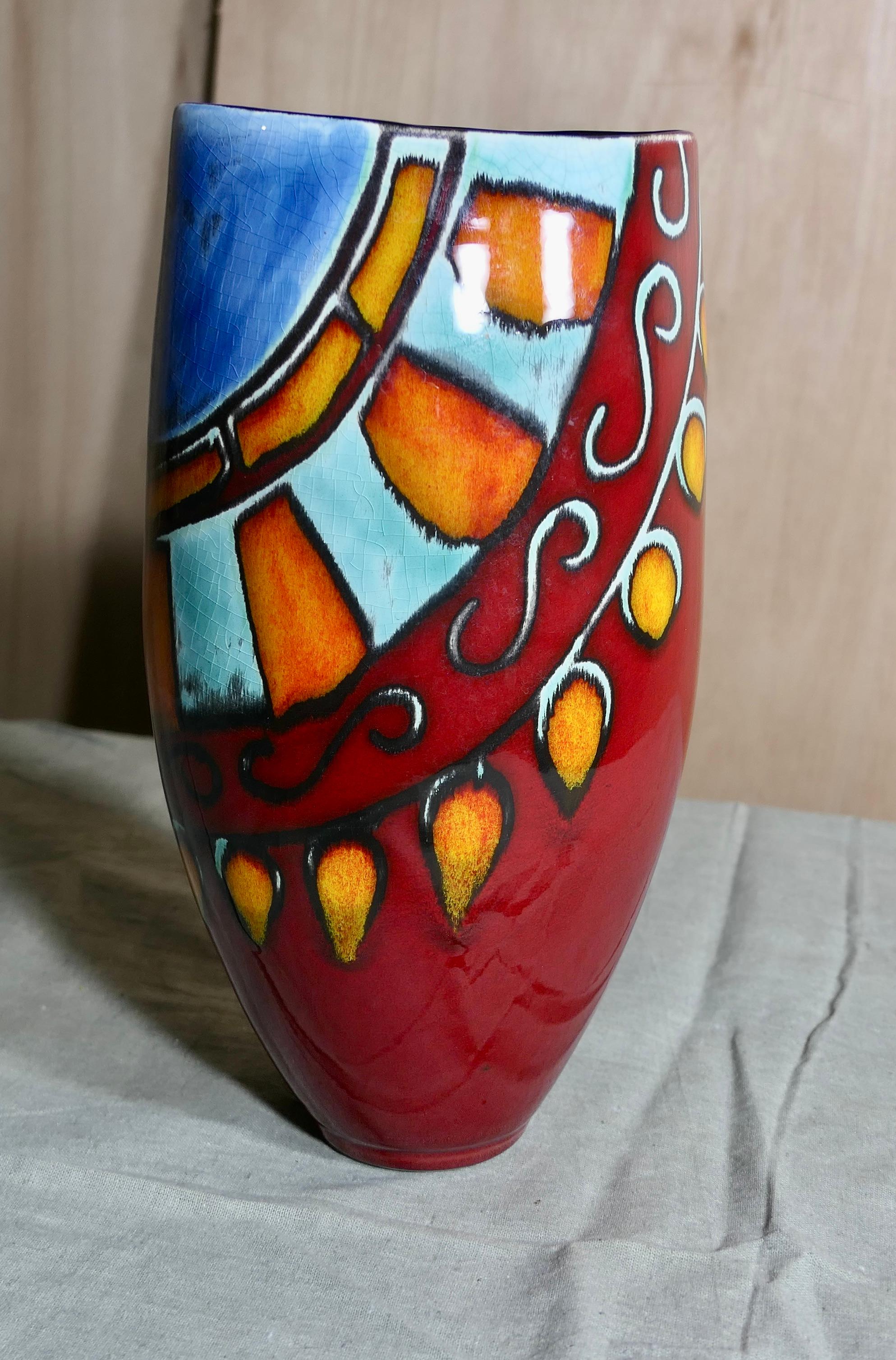  Poole Pottery Vase by Anita Harris

 Lovely vibrant colours. A delightful piece by Anita Harris
In Volcano Colours an Aztec style design, this lovely bright oval vase is in good condition, it is 11” tall, 6” wide and 5” deep
CS247
