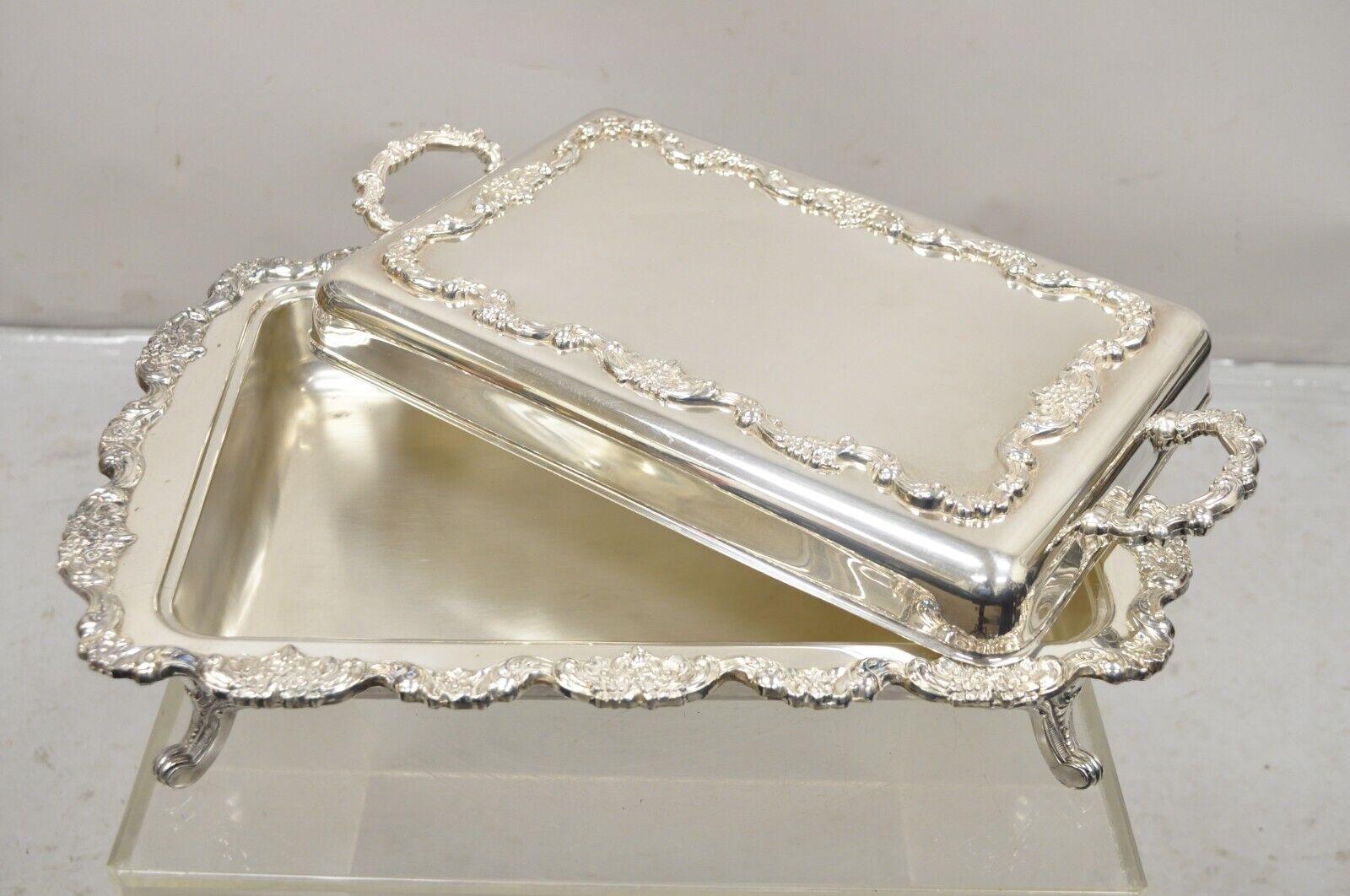 Vintage Poole Silver Co. Victorian Style Silver Plated Large Lidded Covered Serving Platter Dish. Item featured is a large impressive size, ornate floral handles and border, original hallmark, raised on feet. Circa Mid 20th Century. Measurements: 