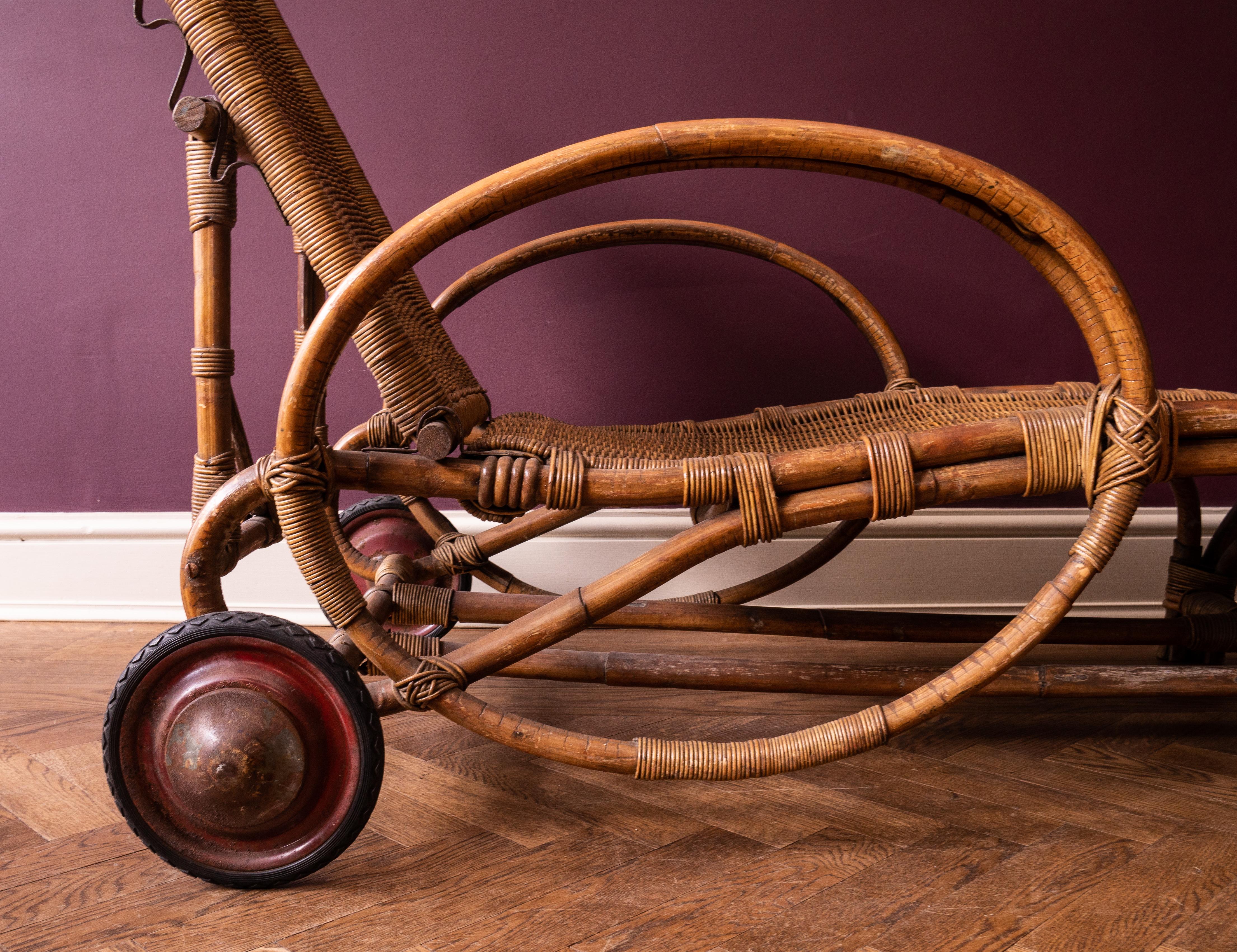 Definitive Bauhaus elegance - an iconic and rare collector piece in excellent original condition. Bentwood, woven cane, red enameled steel and rubber wheels.

Attributed to Erich Dieckmann
When the Bauhaus school moved to Dessau in 1925, Erich