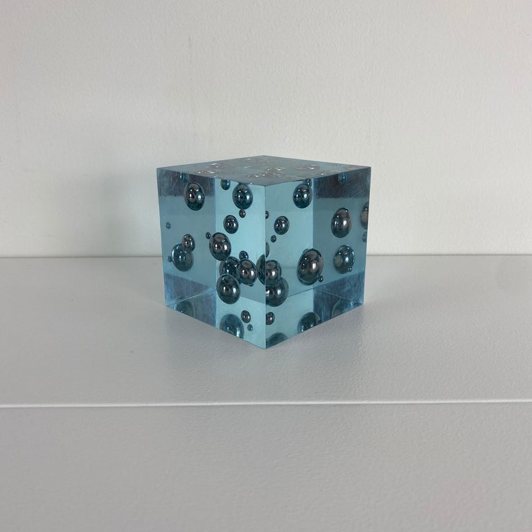 Vintage blue lucite cube sculpture with suspended steel marbles. In the style of Enzo Mari.
