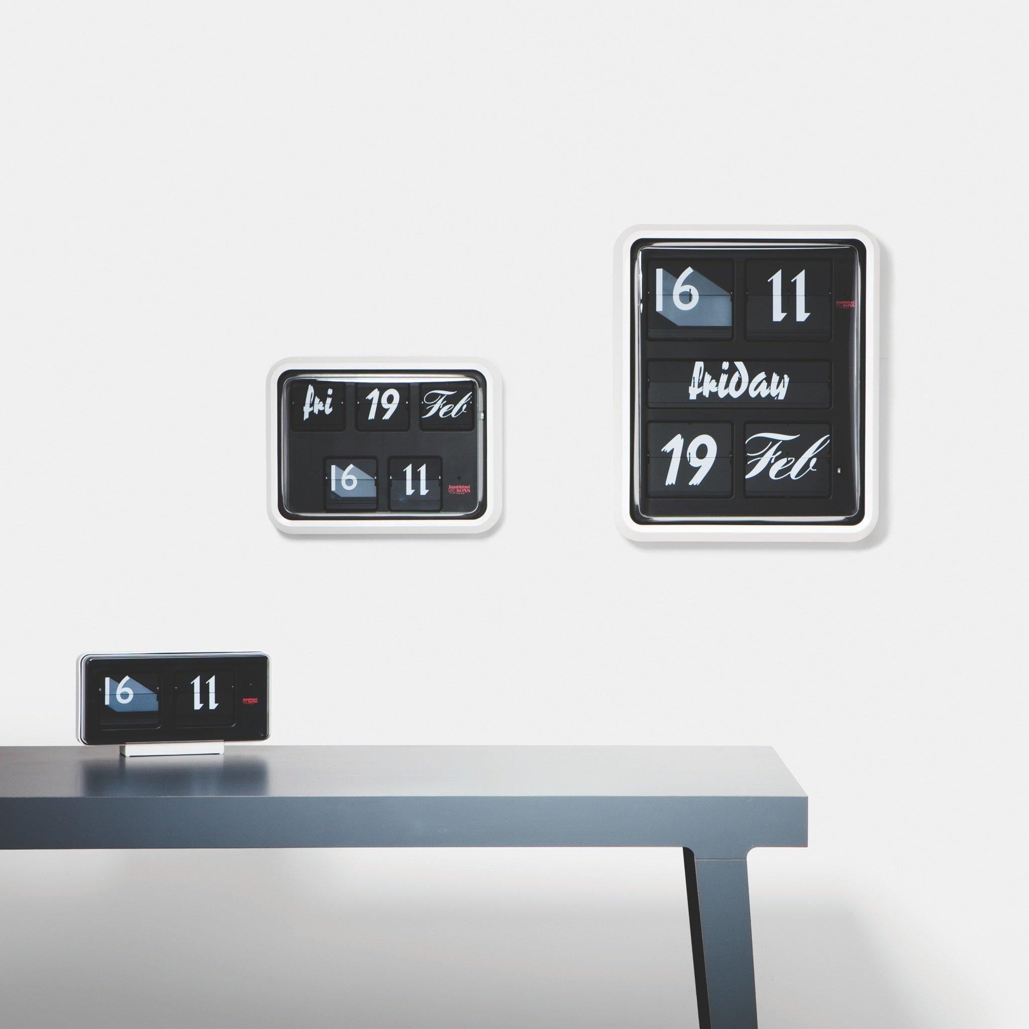 ( Discount as Set ) The Font Clock takes the iconic calendar clock with its distinctive form and flip mechanism and introduces a variety of contemporary typefaces in an ever-changing display. Twelve very different typefaces are employed in the