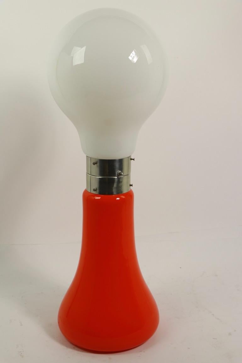 Vibrant and playful Pop Art lipstick lamp by Carlo Nason for Mazzega, Italian, circa 1960s. This example is in very fine, original, clean and working condition, it accepts standard size screw in bulbs, one on top, one on the bottom. The lamp can