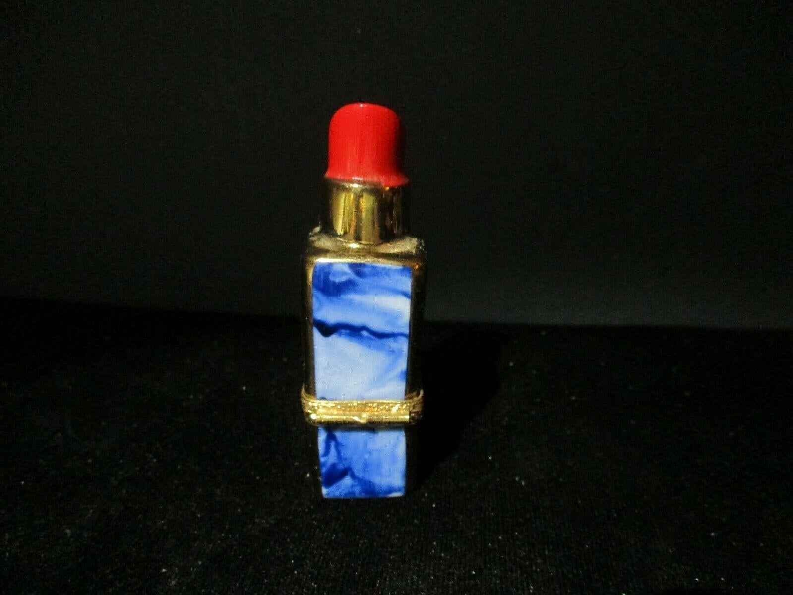 Rare Limoges France Rochard Peint main trinket box crimson lipstick in blue marbled case with brass accent. Marked as shown. The hinged lidded trinket box measures 1.25 inches tall, and 2 inches in diameter. Signed/ marked.