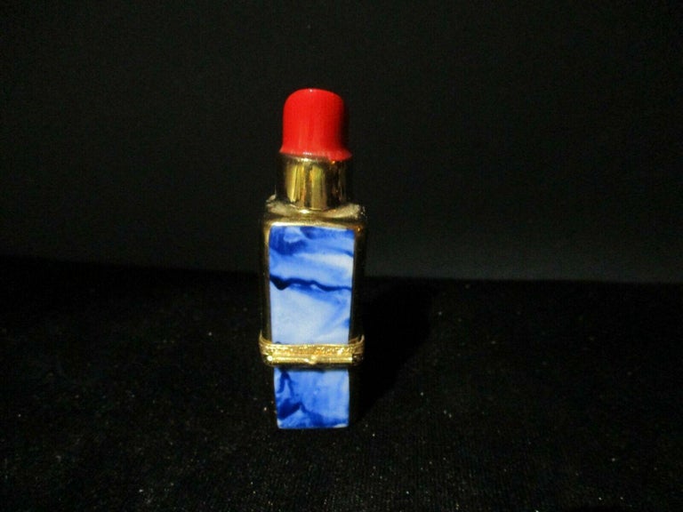 Rare Limoges France Rochard Peint main trinket box crimson lipstick in blue marbled case with brass accent. Marked as shown. The hinged lidded trinket box measures 1.25 inches tall, and 2 inches in diameter. Signed/ marked.