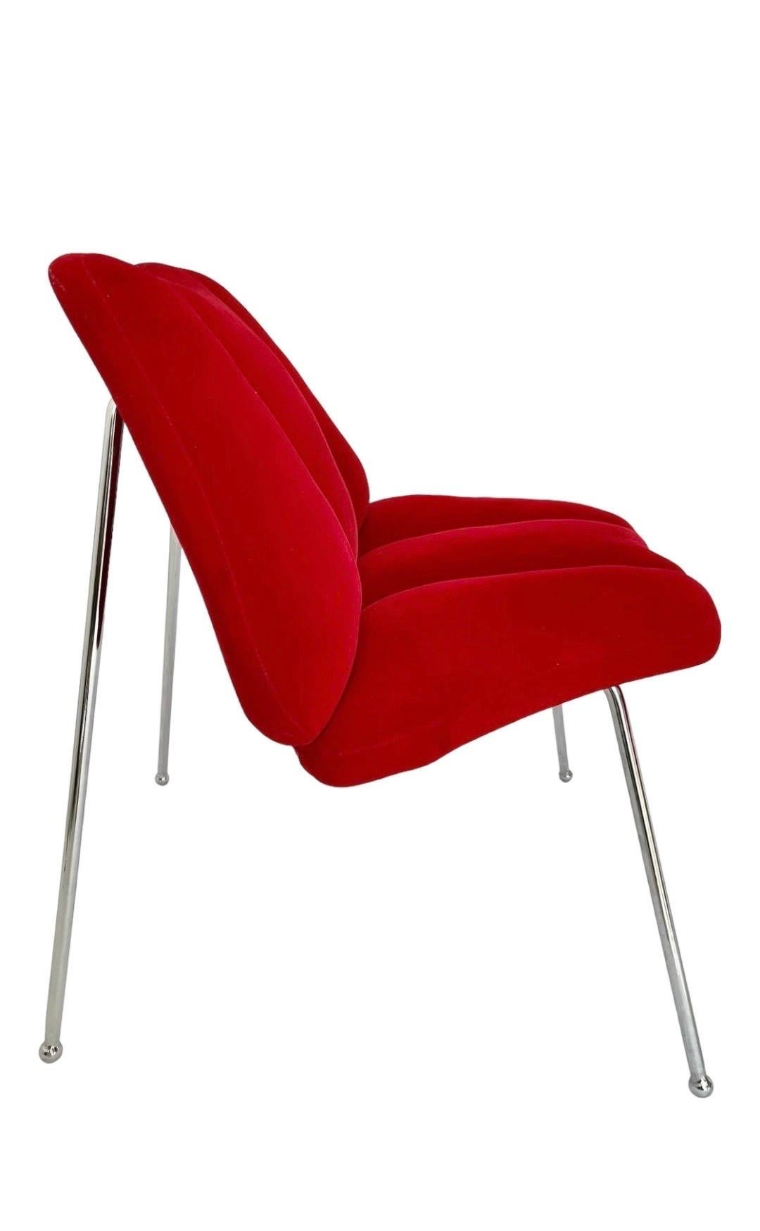 This is a fun Pop Art themed chair in the shape of a set of red lips. 

Its a high quality piece, upholstered in soft cherry red velvet with chromed-steel legs. 

It measures 27 inches deep, 26 inches wide, and is 27.5 inches high. It has a seat