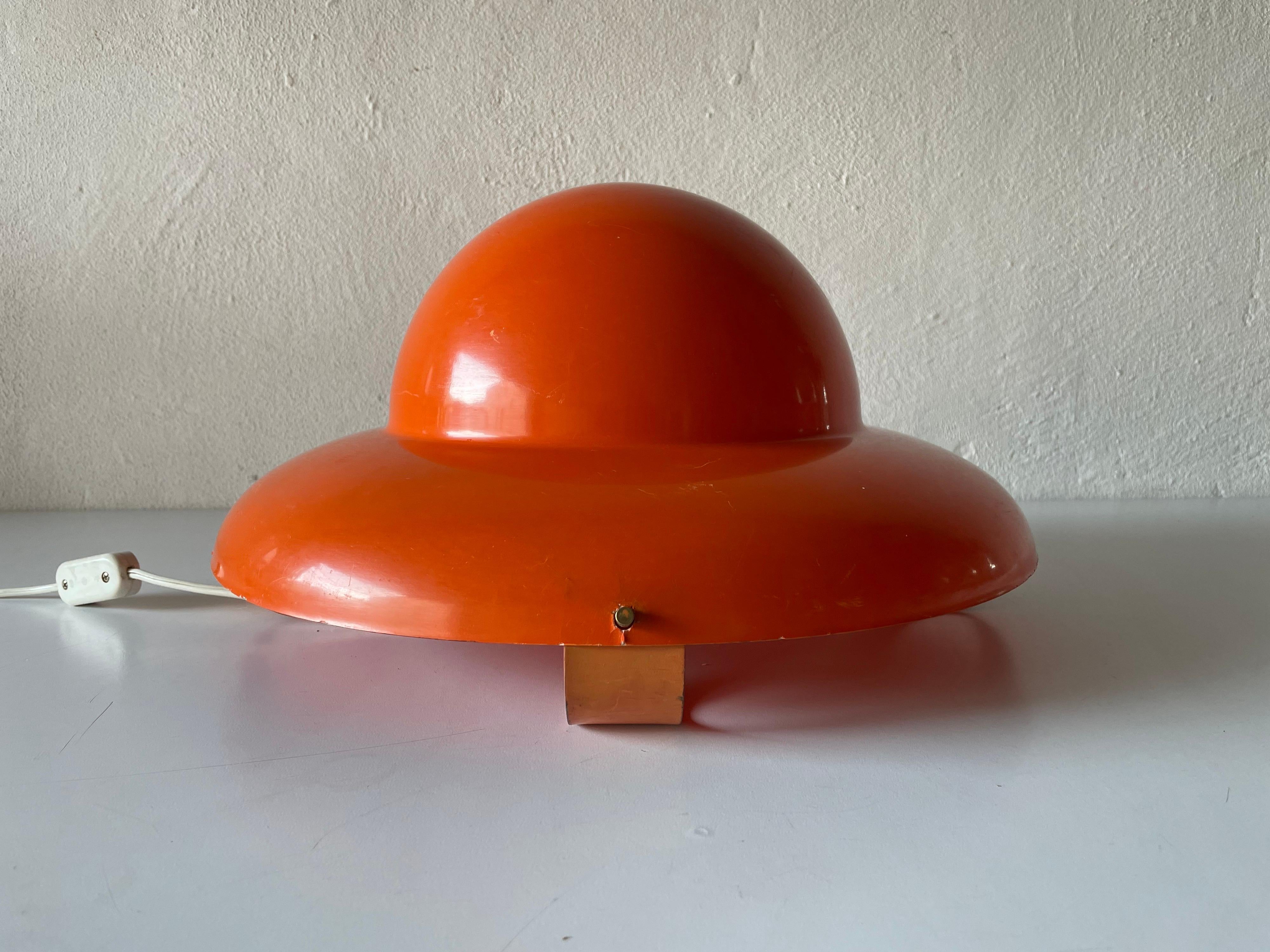 Pop art orange plastic polyester UFO design lovely table lamp, 1970s, Italy

Lampshade is in very good vintage condition.

This lamp works with E27 light bulbs. 
Wired and suitable to use with 220V and 110V for all