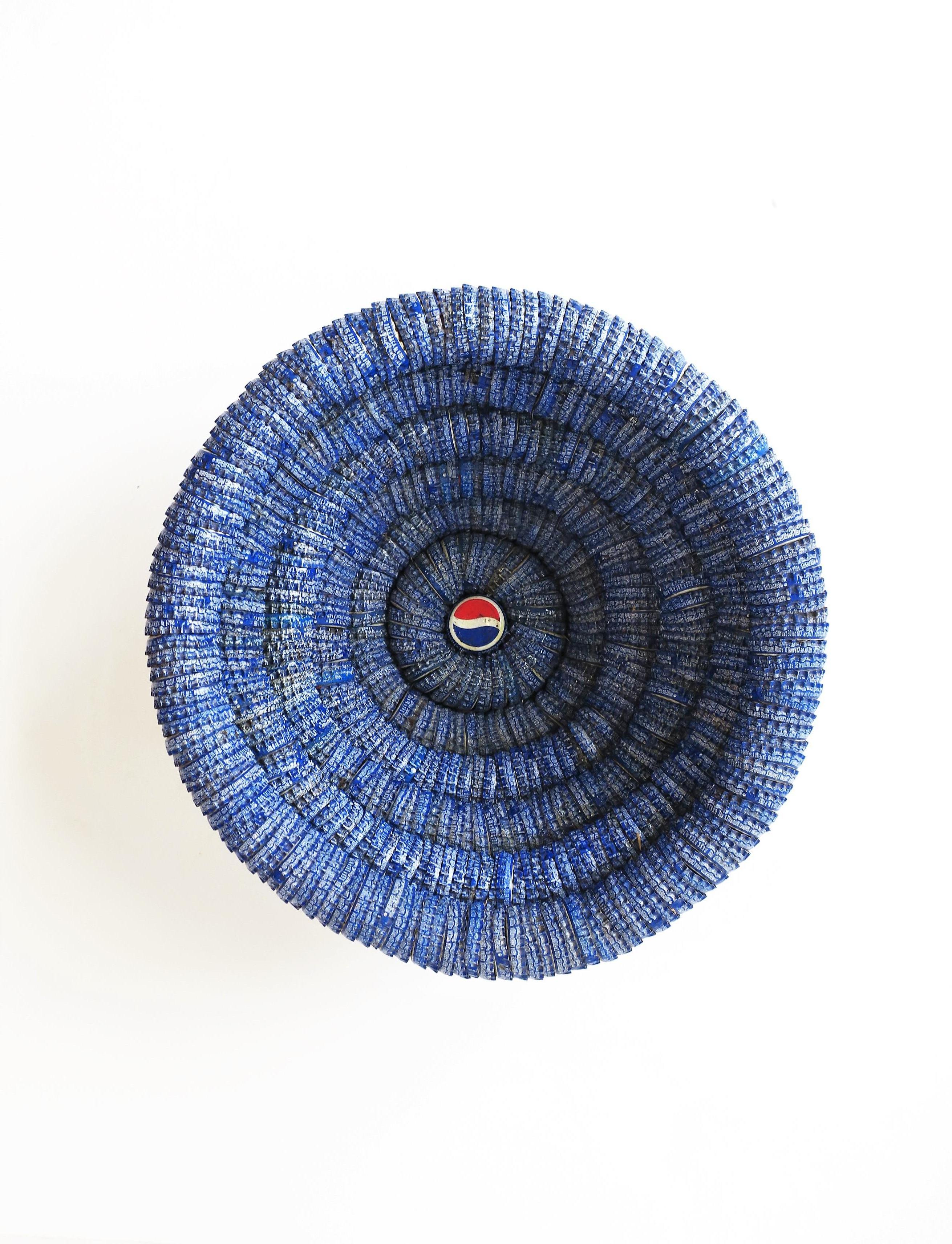 A great Pop Art Pepsi-Cola bowl made from the iconic red, white, and blue metal bottle caps, circa 1990s, late-20th century, USA. Entire bowl is made from authentic metal Pepsi-Cola bottle caps. Bowl is hand-crafted and well made. 

Piece measures: