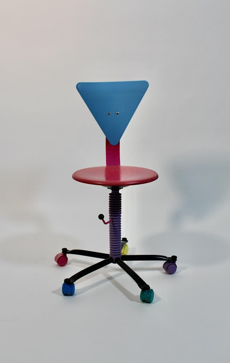 Pop Art vintage office desk chair from metal and wood in pink and blue 1980s.
An amazing office desk with swiveling function and adjustable seat height with a screw from 43 cm to 50 cm from stained plywood and metal.
While the triangular back