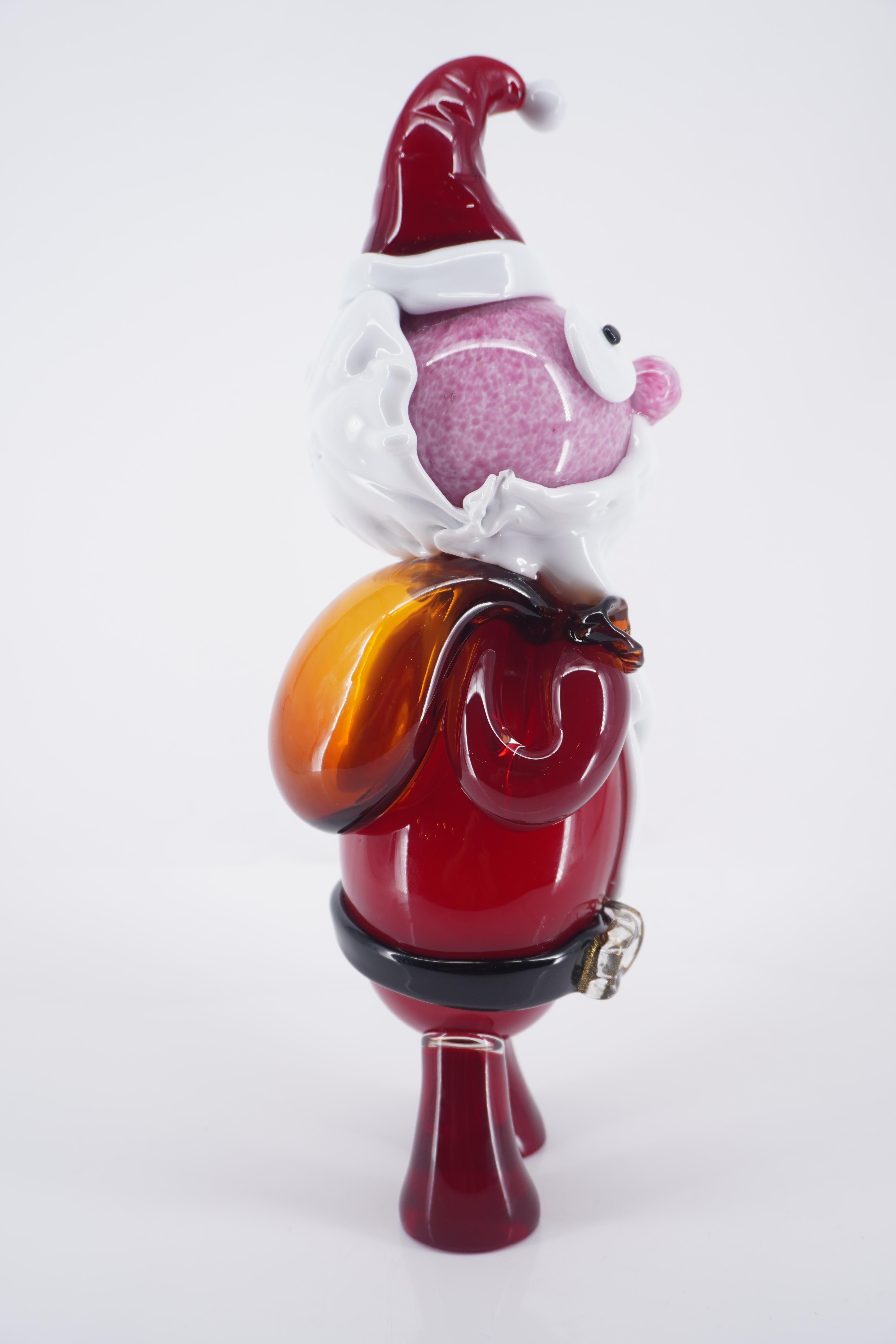 Santa Claus is a blown glass a new sculpture created by Roberto Beltrami, in Murano glass,  a tribute to the Chirstmas time.

Part of a comic and pop collection in Murano glass, the 'PUPI' are 100% mouth-blown and entirely handmade, offering