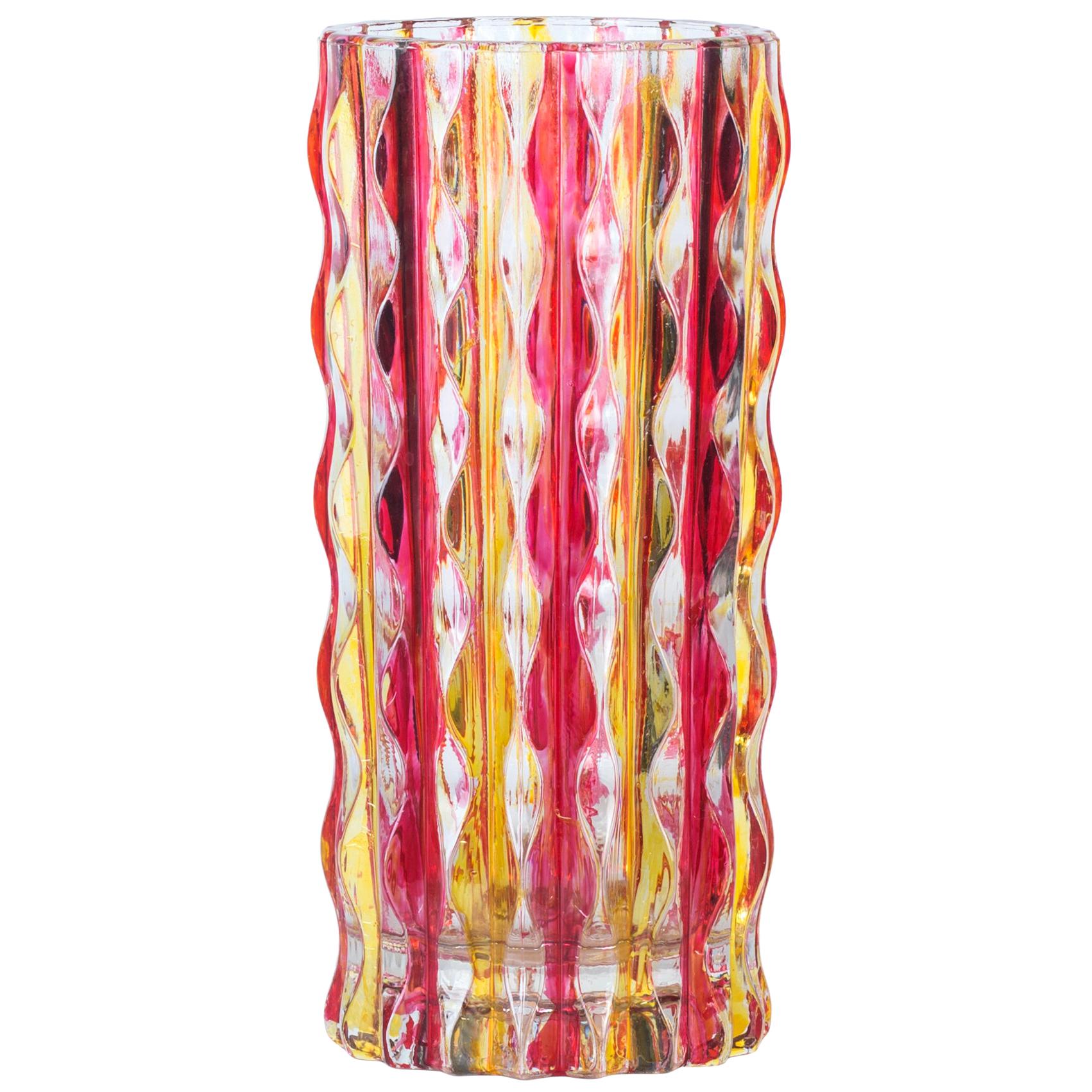 Pop glass vase is a beautiful glass decorative object, realized by an Italian manufacture during the 1970s. 

Very fashionable pink and yellow colored vase with multifaceted decorations in relief along the body.

Very good conditions.