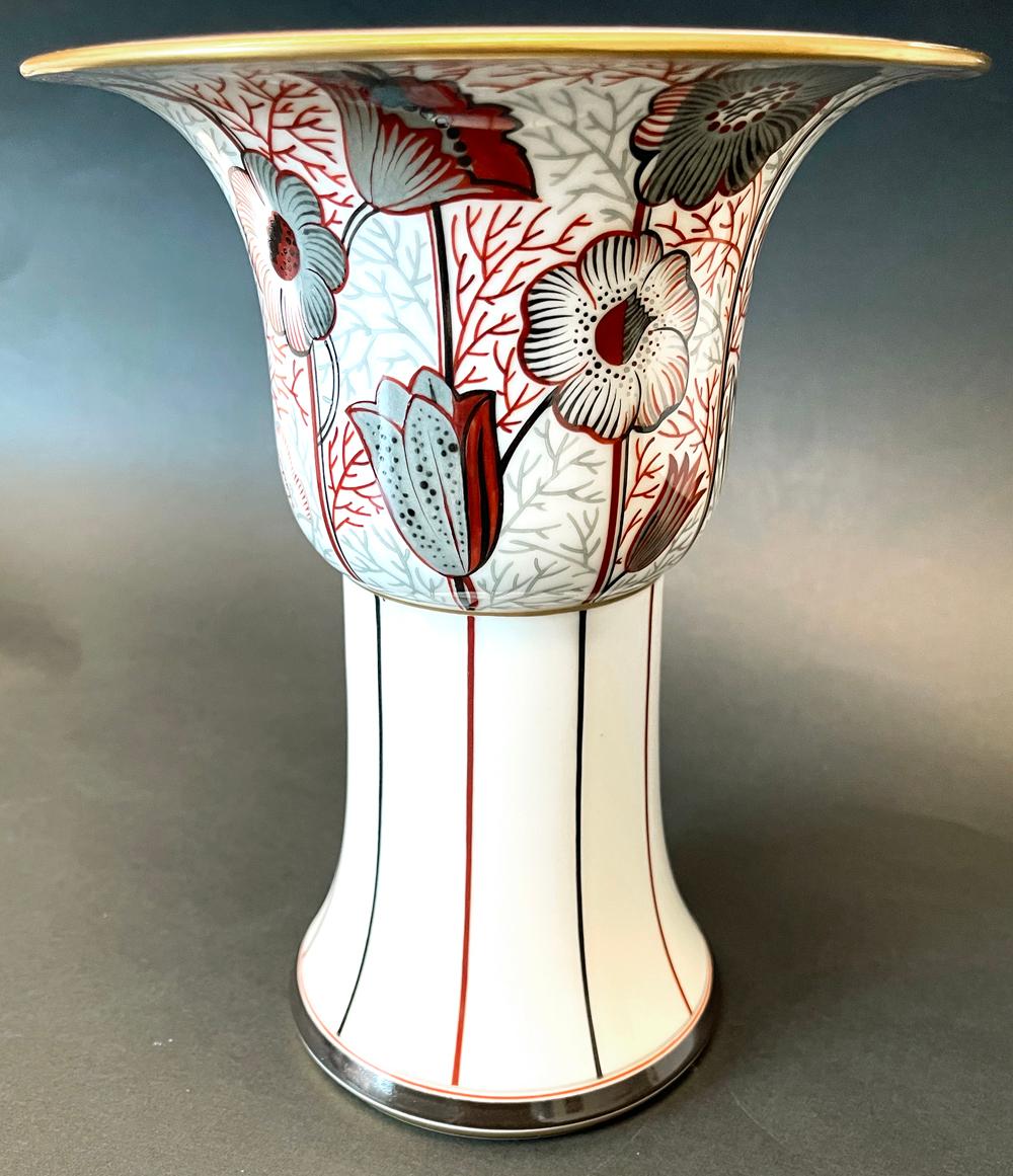 One of the most exquisitely designed and painted Art Deco pieces we have ever seen, this flaring vase by Anne Marie Fontaine for Sevres features a flaring, trumpet-form upper section over a tapering base, all in deep red, black and grey glazes over