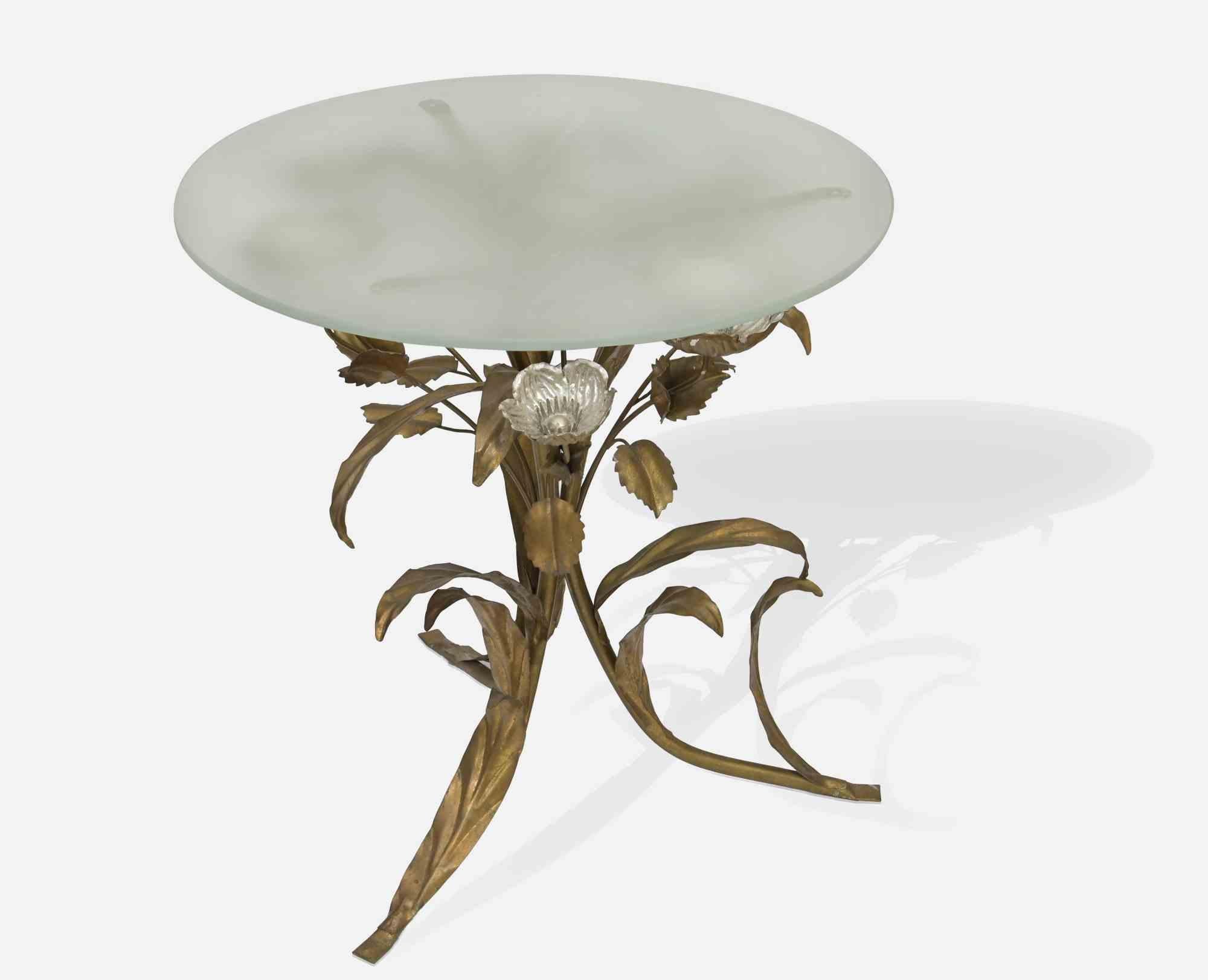 Poppies coffee table is a hand made furniture, in the style of Hans Kogl.

Hand Crafted Brass and glass, 1980s. 

Table base: height 52 cm ; maximum depth 53; kg 2,1. 

Glass diameter 50 cm ; kg 3.8. 

Very good condition. 