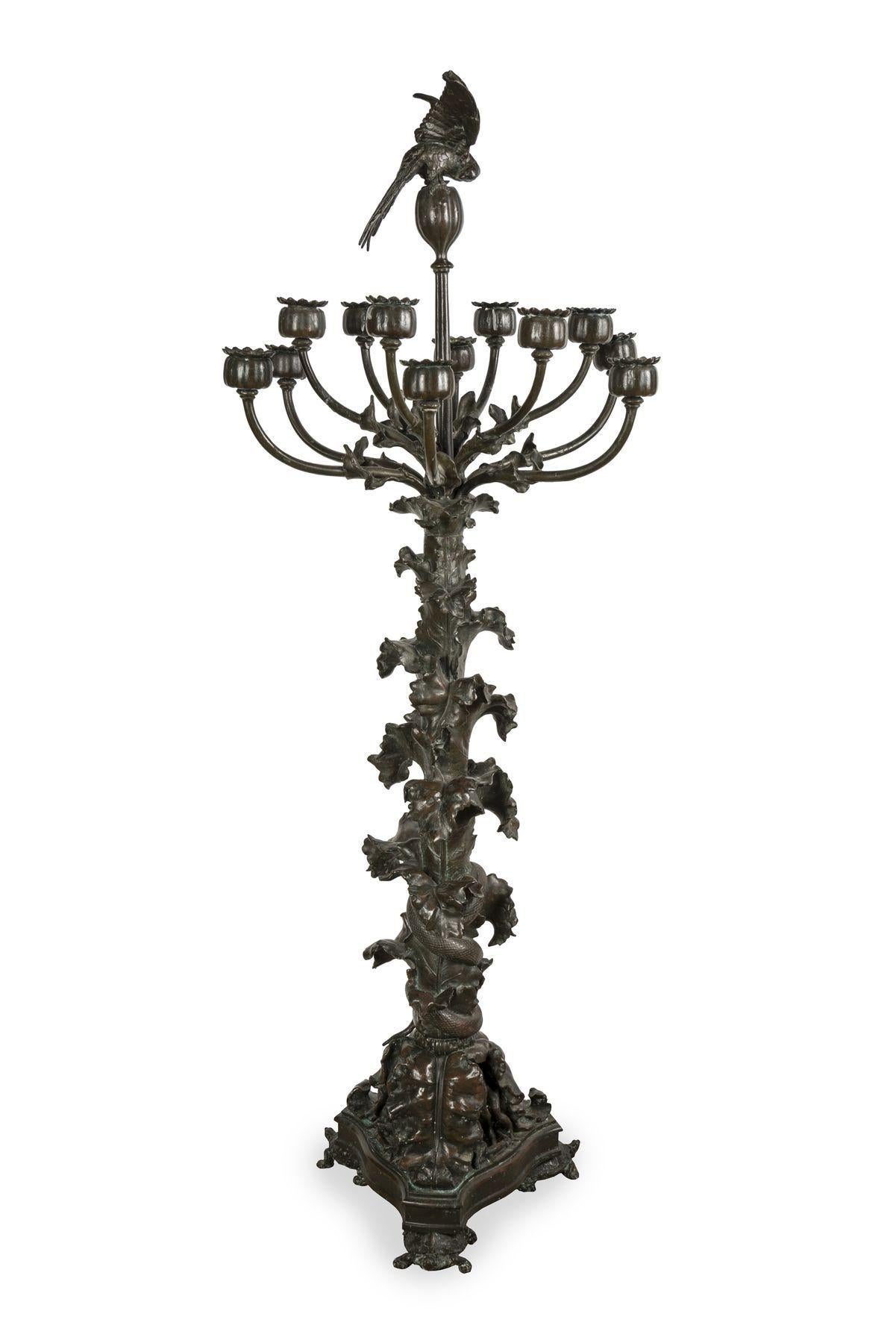 Poppy and parakeet candelabra by Antoine-Louis Barye, circa 1850
Patinated bronze
Middle of the 19th century
Measures: Height 98 cm, diameter (branches) 38 cm, length (foot) 25 cm.

Large pair of bronze candelabra with a brown patina, composed