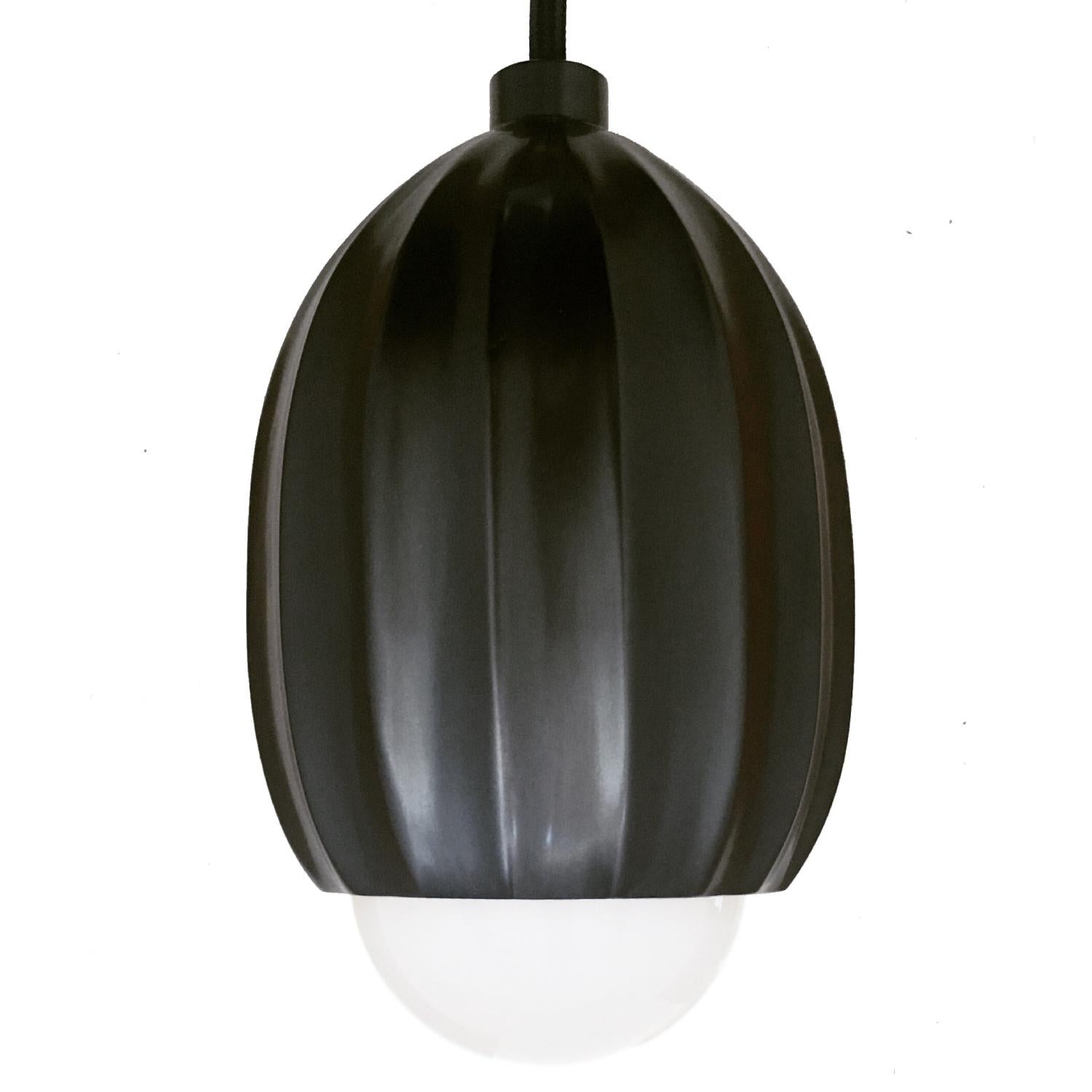 Poppy Blackened Brass Pendant Lamp by Fred and Juul
Dimensions: Ø 10 x D 300 cm.
Materials: Blackened brass.

Available in polished brass or blackened brass. Cord length can be extended on request. Custom sizes, materials or finishes are available