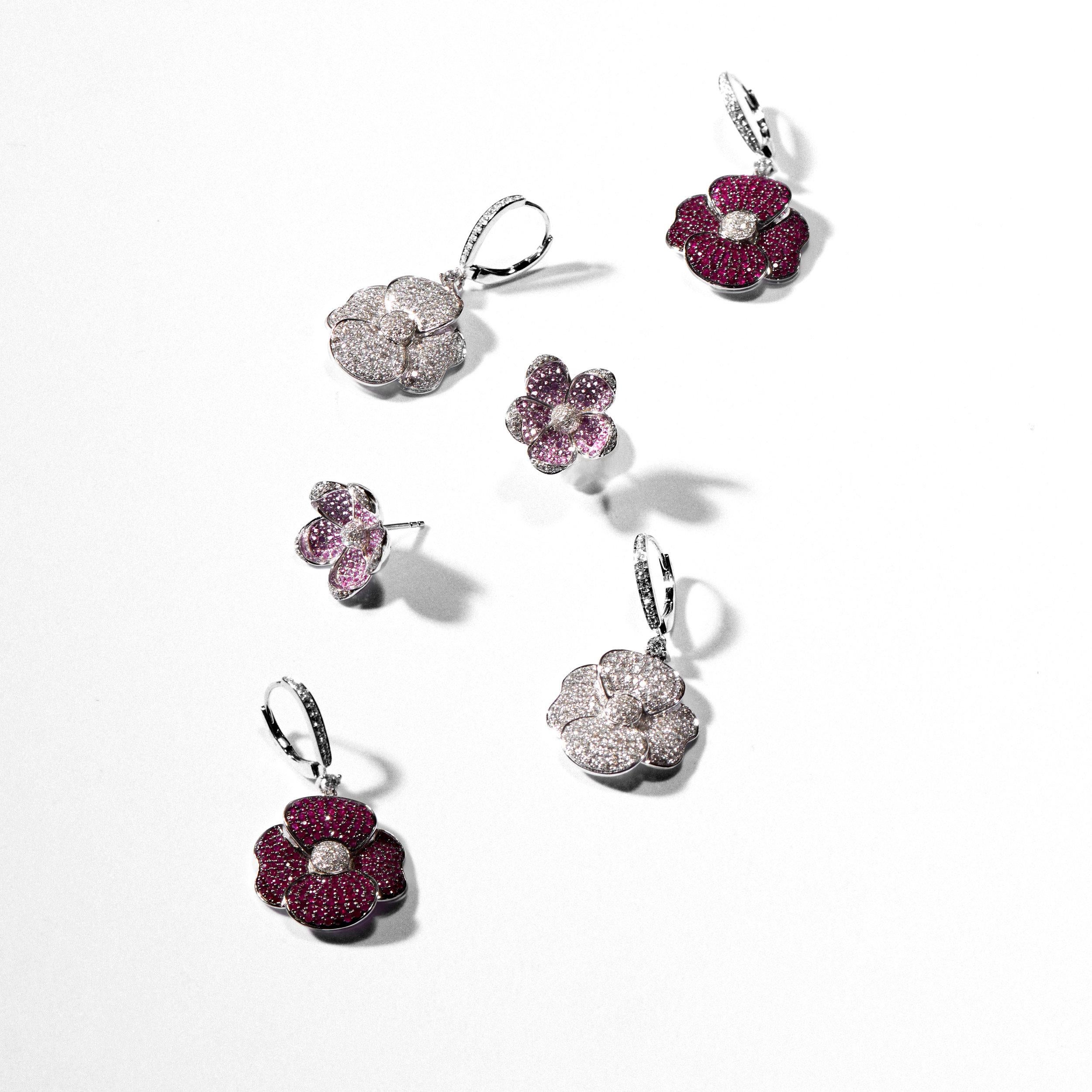 Like a blooming flower sparkling with brilliant color, the Poppy Ruby and Diamond Earrings add a dramatic element to any outfit. Featuring a floral motif design inspired by the classical beauty found in nature, these eye-catching earrings showcase