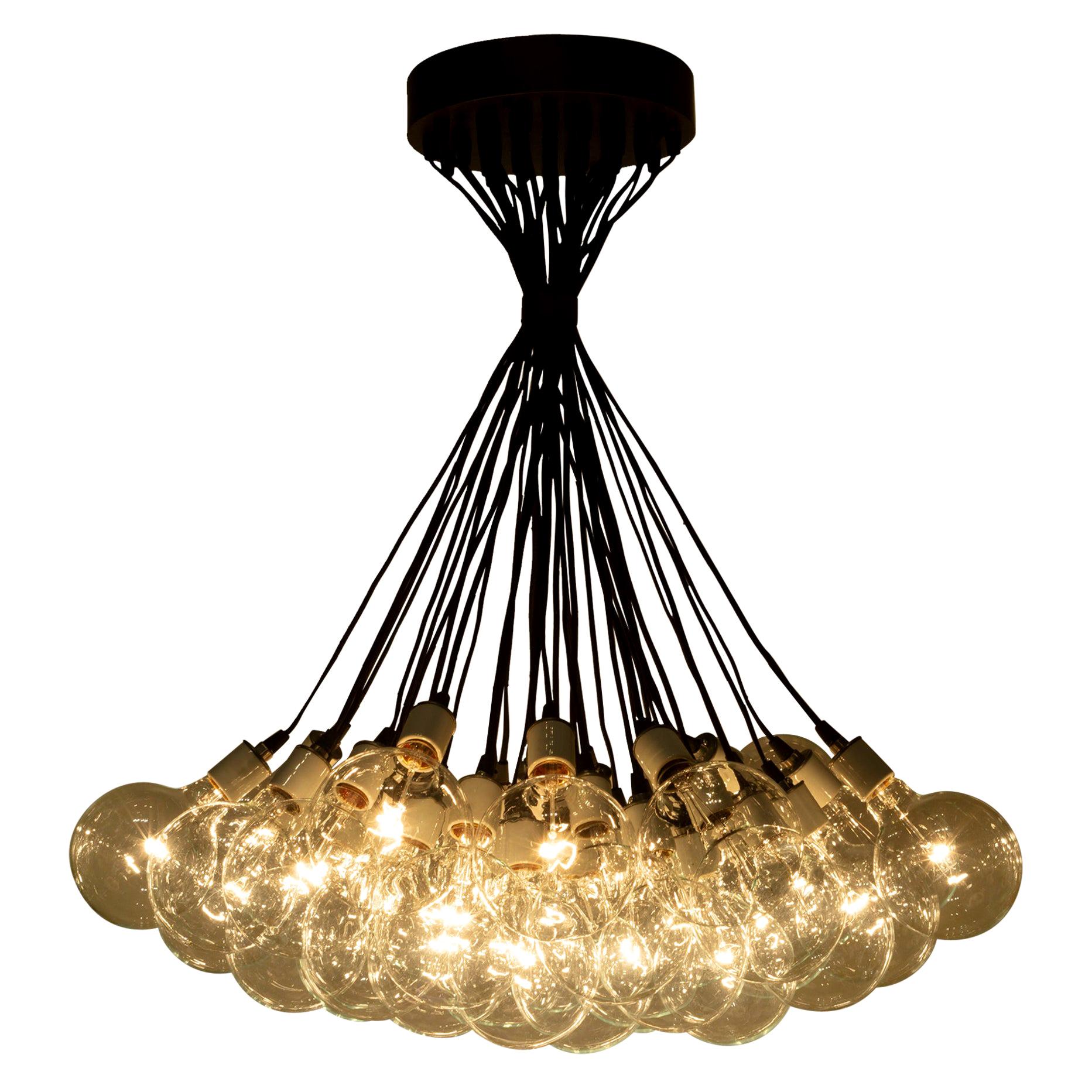 ABOUT

An original chandelier with a cluster for thirty-seven large bulbs in white ceramic insulators. Large bronze canopy with hook and adjustable bronze collar. Attached plug-in cord. Large LED bulbs. Approximately 15 bulbs need replacing.

   