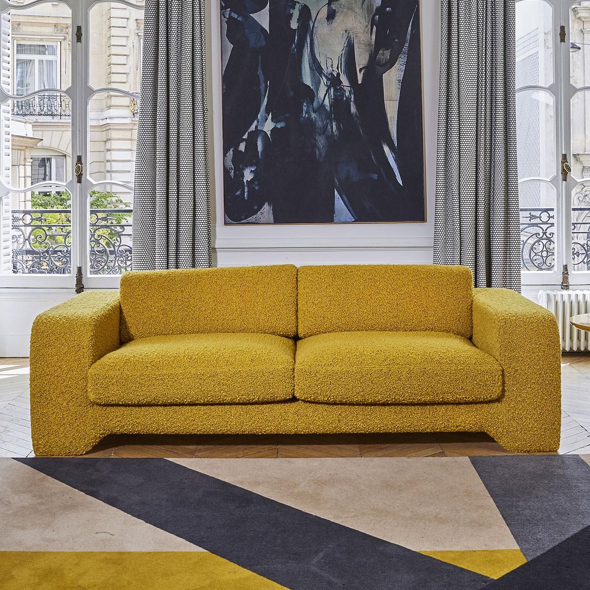 Popus Editions Giovanna 2.5 seater sofa in grey Como velvet upholstery.

Giovanna is a sofa with a strong profile. A sober, plush line, with this famous detail that changes everything, so as not to forget its strength of character and this