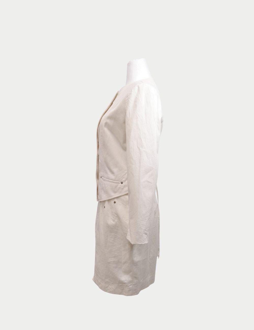 Step into vintage sophistication with this Popylloreni Cream Two-Piece Skirt Suit. Crafted with timeless tailoring, the jacket features a rounded neckline, bold button-down closure, and a flattering fitted silhouette. The matching high-waisted skirt