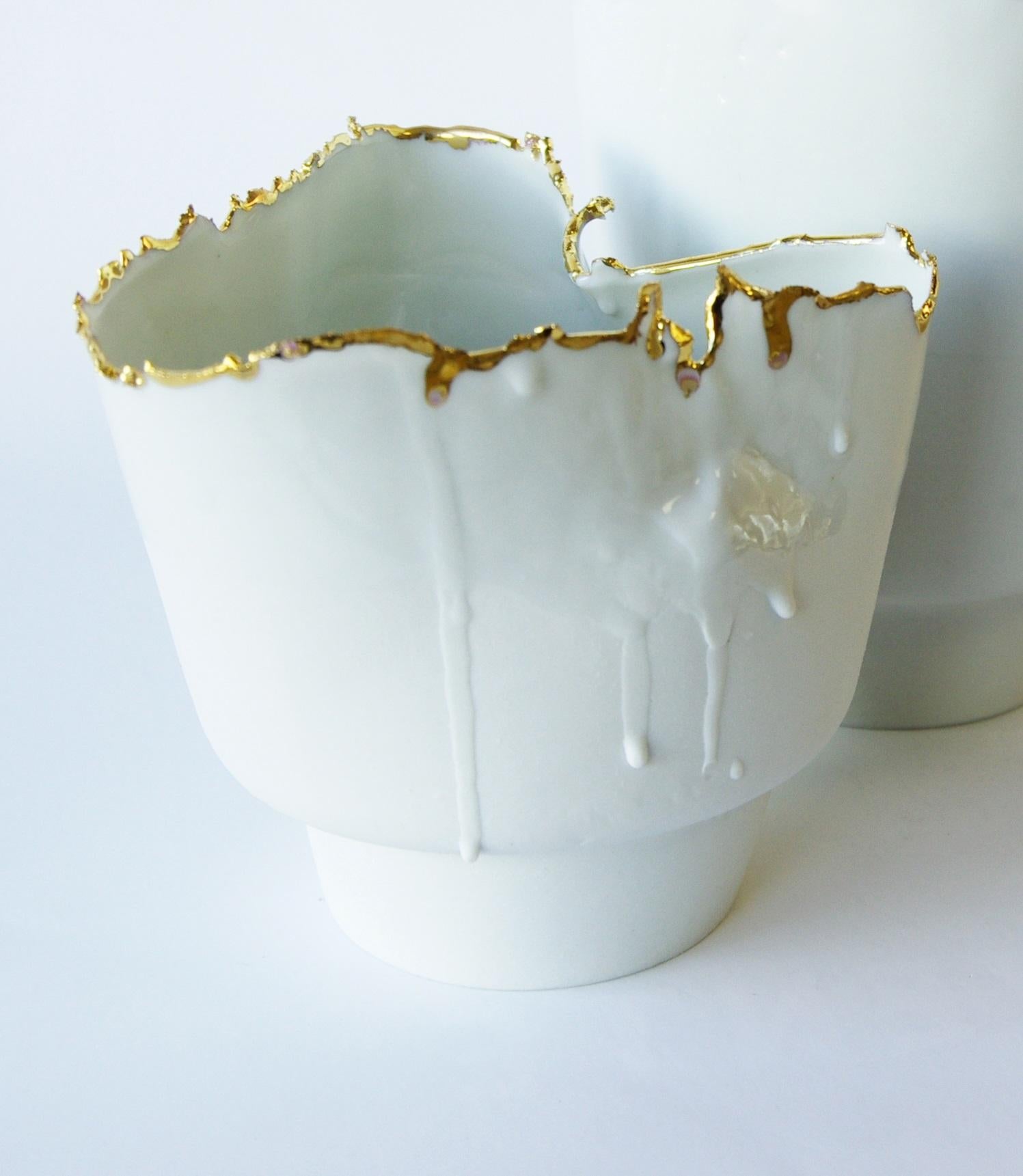 Porcelain and Gold Vase Small Imperfections by Dora Stanczel
One of a Kind.
Dimensions: D 13 x W 13 x H 12 cm.
Materials: Porcelain and gold.

I create bespoke and luxurious porcelain pieces with a careful aesthetic. Beyond the technical mastery of