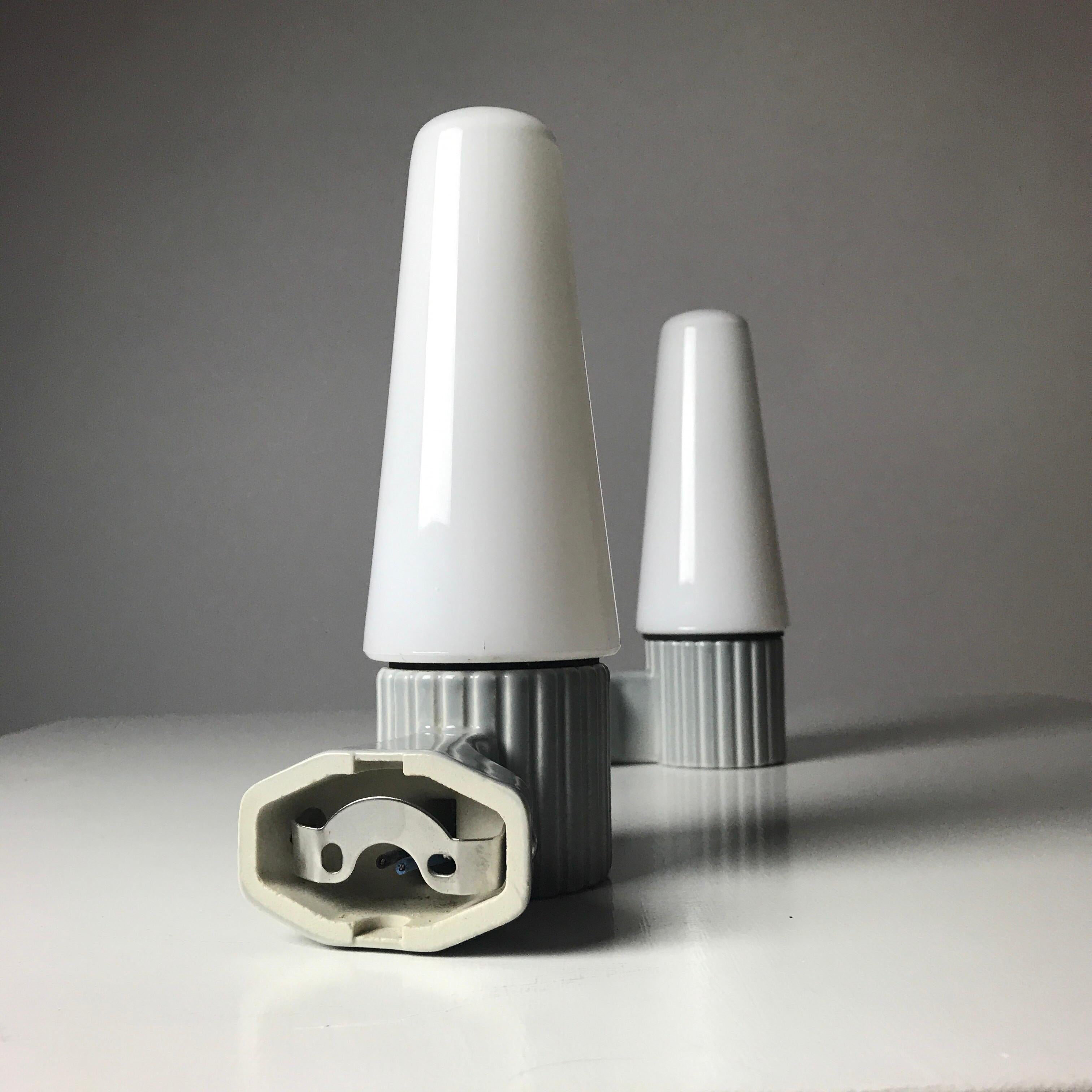 Soft mint gray glazed porcelain combined with cone shaped milky white opaline glass is just a beautiful scandinavian midcentury design by Sigvard Bernadotte for IFÖ, Sweden 1960s. 

This set of two sconces has all the components, screws, wall