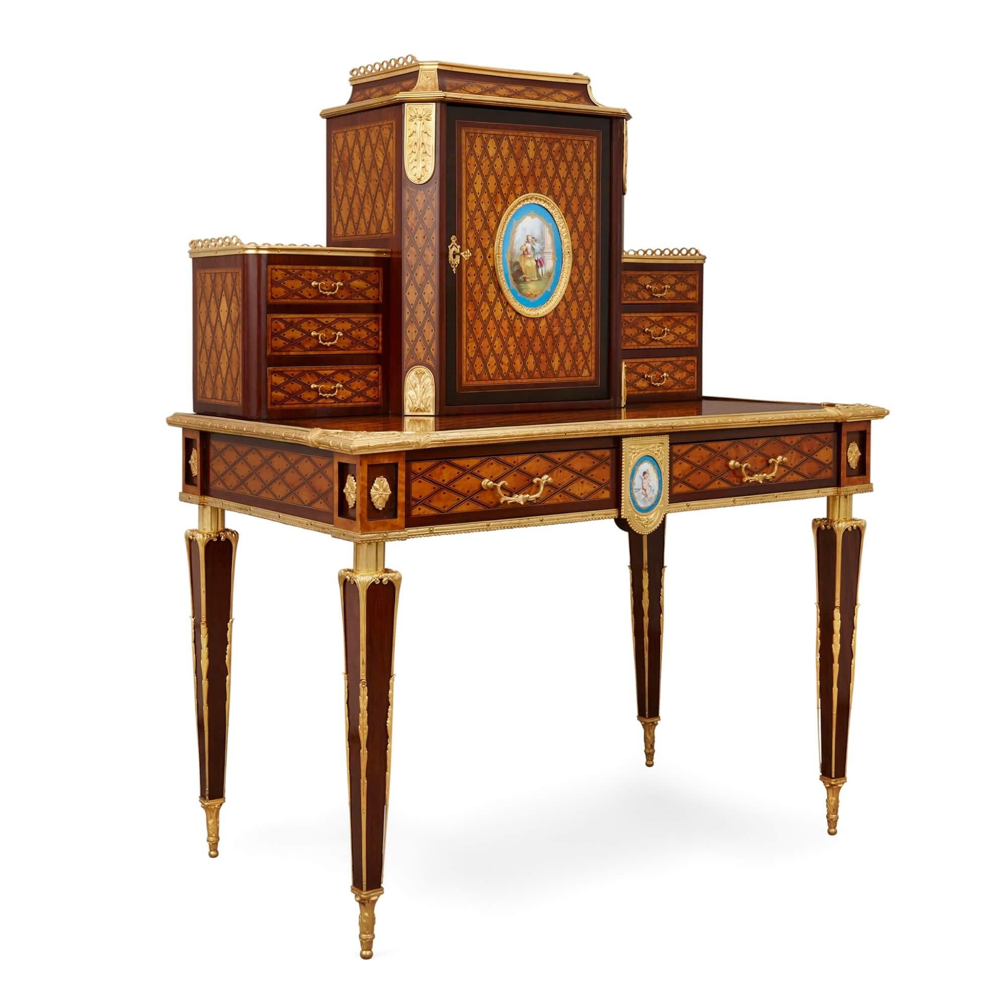 Porcelain and ormolu mounted bonheur du jour by Donald Ross.
English, late 19th century.
Measures: height 136cm, width 108cm, depth 62cm

This beautiful writing desk is a 'bonheur du jour', a type of desk traditionally used by upper class French