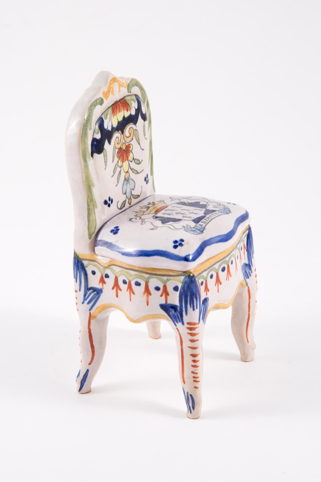 Porcelain armchair shaped jewelry box featuring a faience decorated, a under stamp.
In good vintage condition. Made in France. 
Maxi Length 5.9in. (15cm)
Maxi Width 2.7in (7cm)
We guarantee you will receive this gorgeous item as described and showed