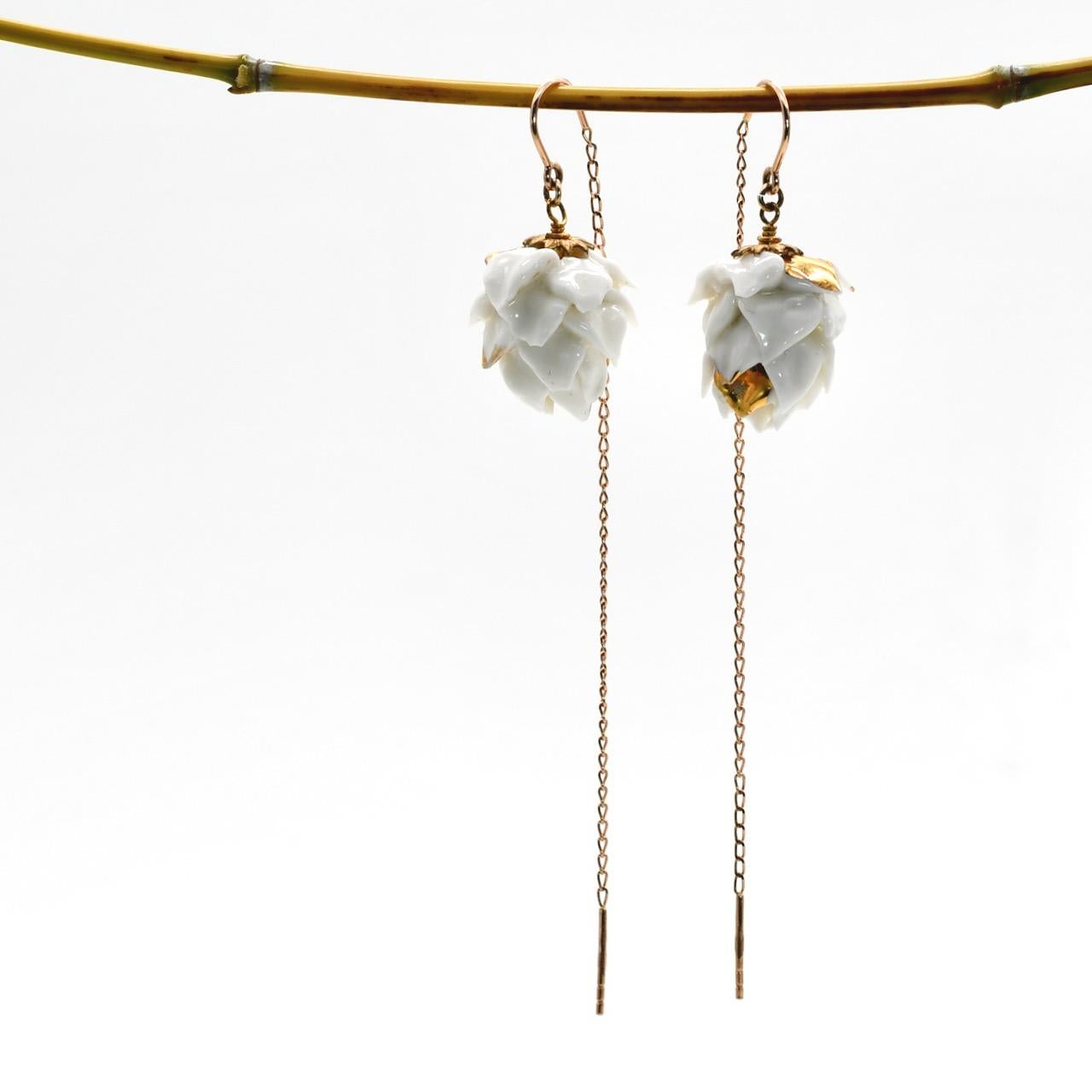 Porcelain  18K gold threaders  24K gold embellishment  Handmade in London

These solid gold pull-through porcelain artichokes earrings are truly one-of-a-kind. The combination of porcelain and solid gold is unbeatable and surely rare find. Intricate