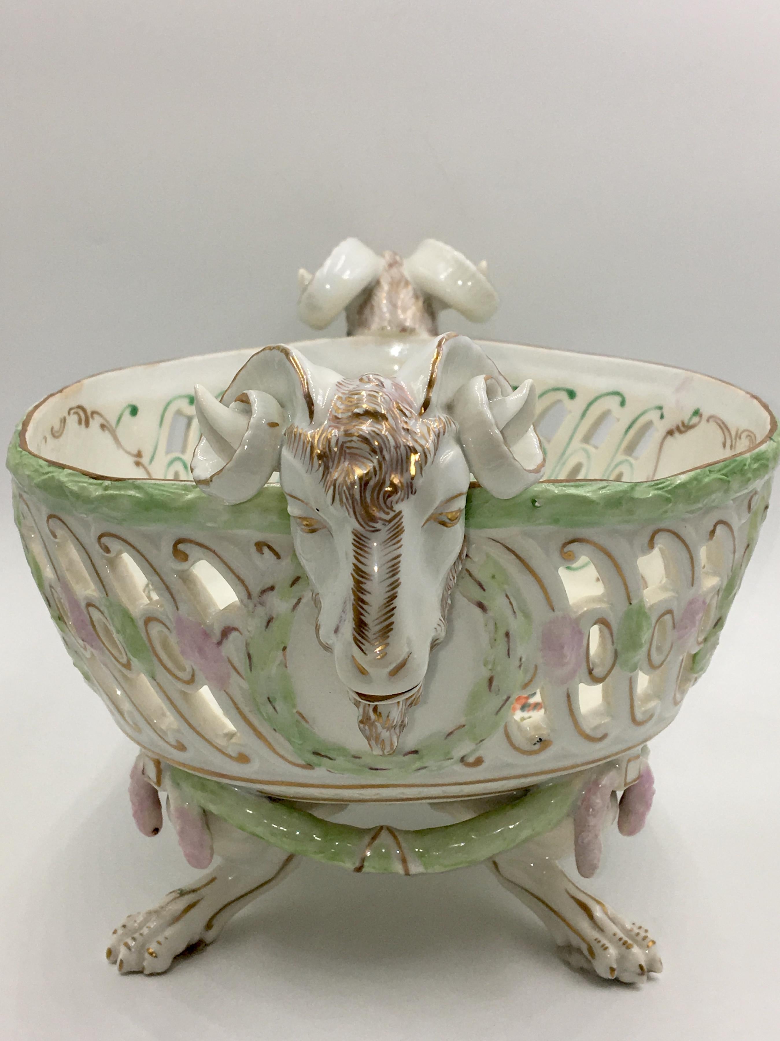 Rare pierced out display basket with 2 rams heads and 4 paw feet after a model of J.C. Schönheit from the 19th century. On the show sides and in the mirror flower decor.
Beautiful blue porcelain brand of Augarten, Vienna on the bottom.