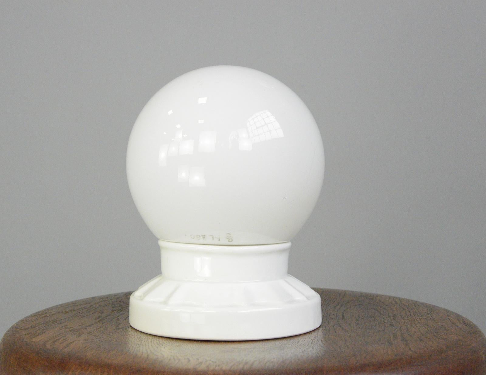 Porcelain bathroom lights by Siemens & Schukert Circa 1920s

- Opaline glass globes
- Vitreous white porcelain wall holders
- Takes E27 fitting bulbs
- By Siemens & Schukert, Berlin
- German ~ 1920s
- 15cm wide x 18cm