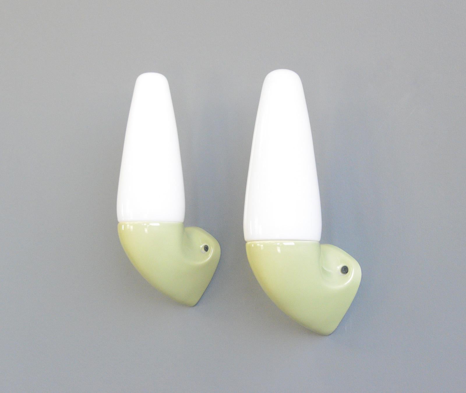 Porcelain Bathroom Lights By Sigvard Bernadotte for Ifo circa 1950s

- Price is per piece (4 available) 
- Vitreous pea green porcelain wall mounts
- Screw off opaline shades
- Takes E27 fitting bulbs
- Wires directly into the wall
- Designed by