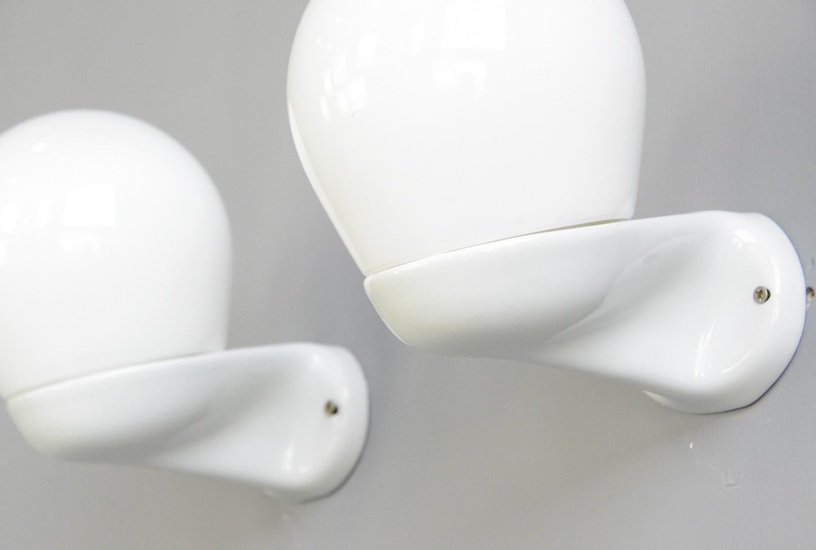 Porcelain bathroom lights by Wagenfeld for Lindner, circa 1950s

- Price is per light (9 available)
- Porcelain wall bracket with opaline glass shade
- Takes E27 fitting bulbs
- Wires directly into the wall
- Model 6040
- Produced by