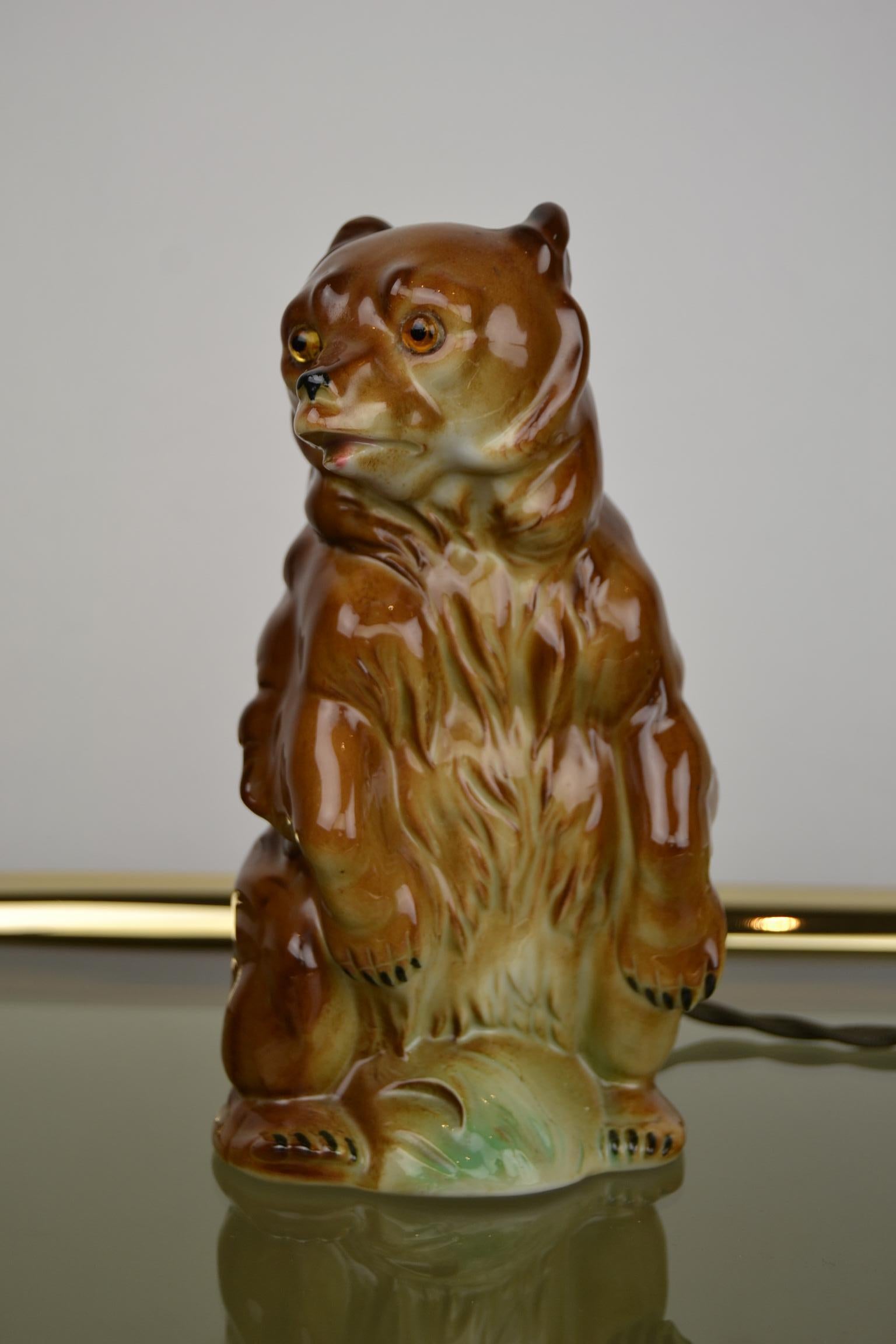 Great looking perfume lamp - Side lamp 
in the shape of a standing bear. 
This Bear figurine is made from porcelain, dates from the 1940s and comes from Germany. 
Plug has been renewed. 

Perfume lamps were used to camouflage bad smell in the