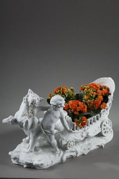 Porcelain biscuit basket decorated with putto and feline, 19th century