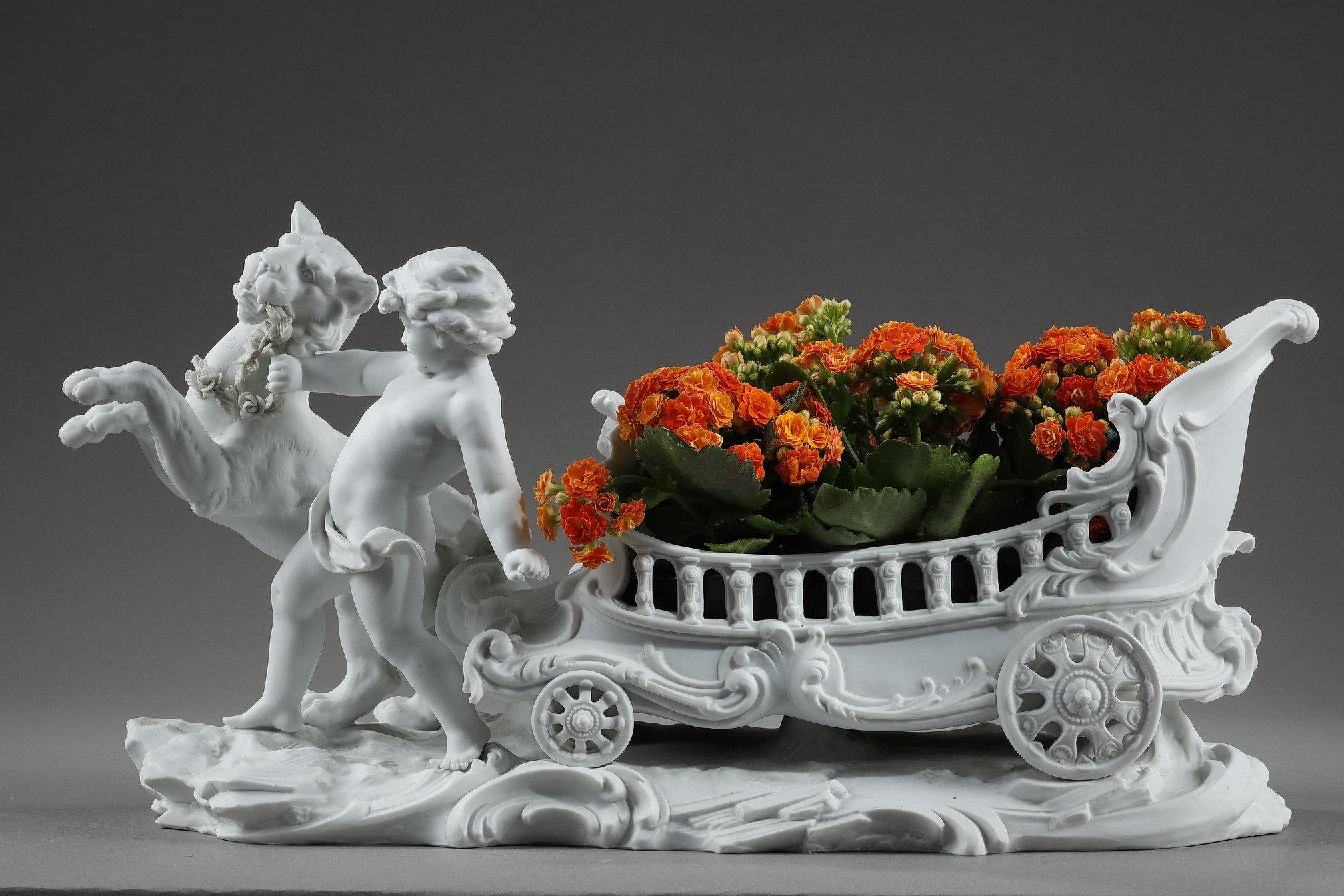 French Porcelain biscuit basket decorated with putto and feline, 19th century