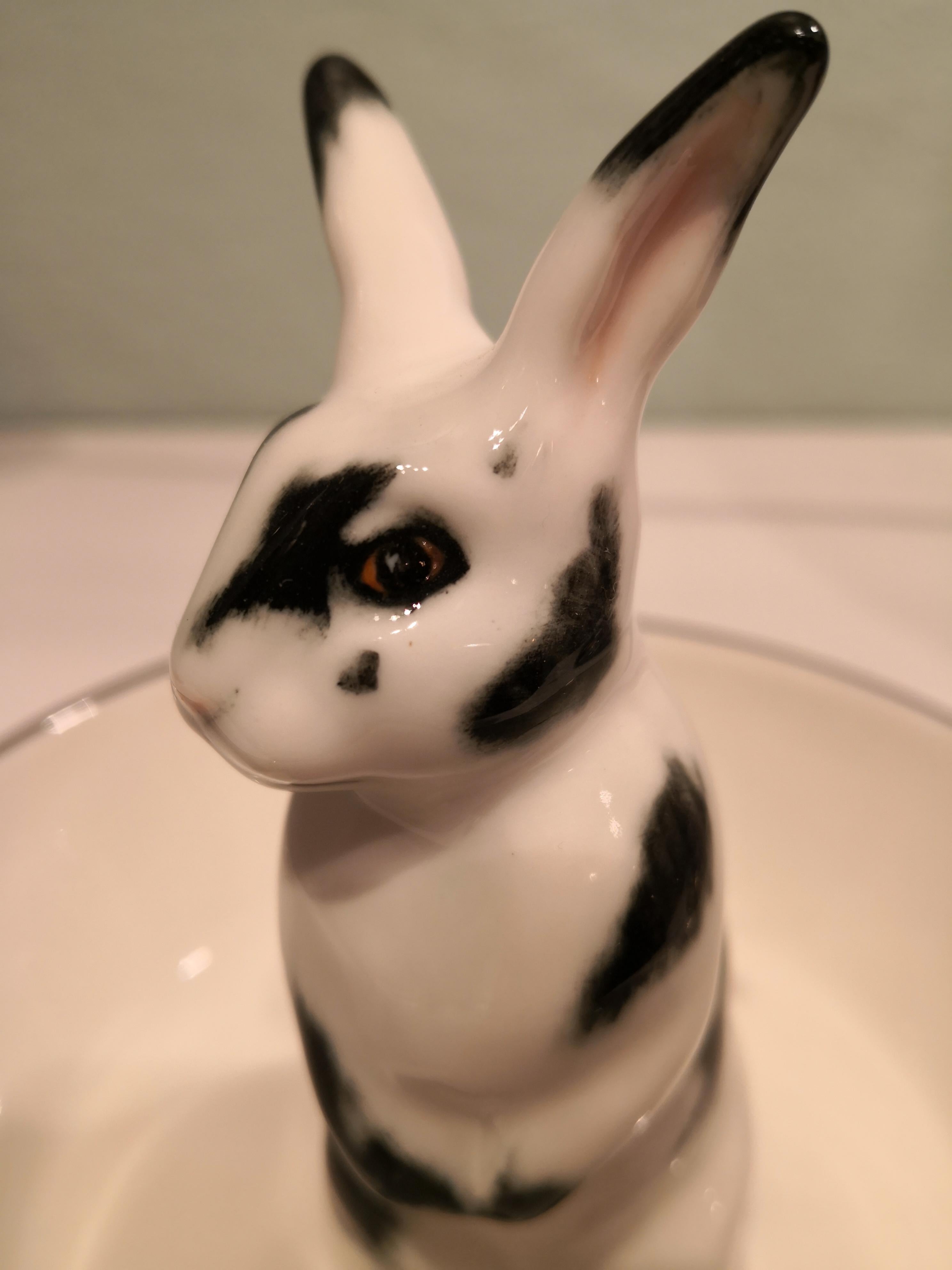 Completely handmade porcelain bowl with a hands-free naturalistic painted Easter rabbit in black and white colors. The rabbit is sitting in the middle of the bowl for decorating nuts or sweets around the figure. Rimmed with a fine platinum line.