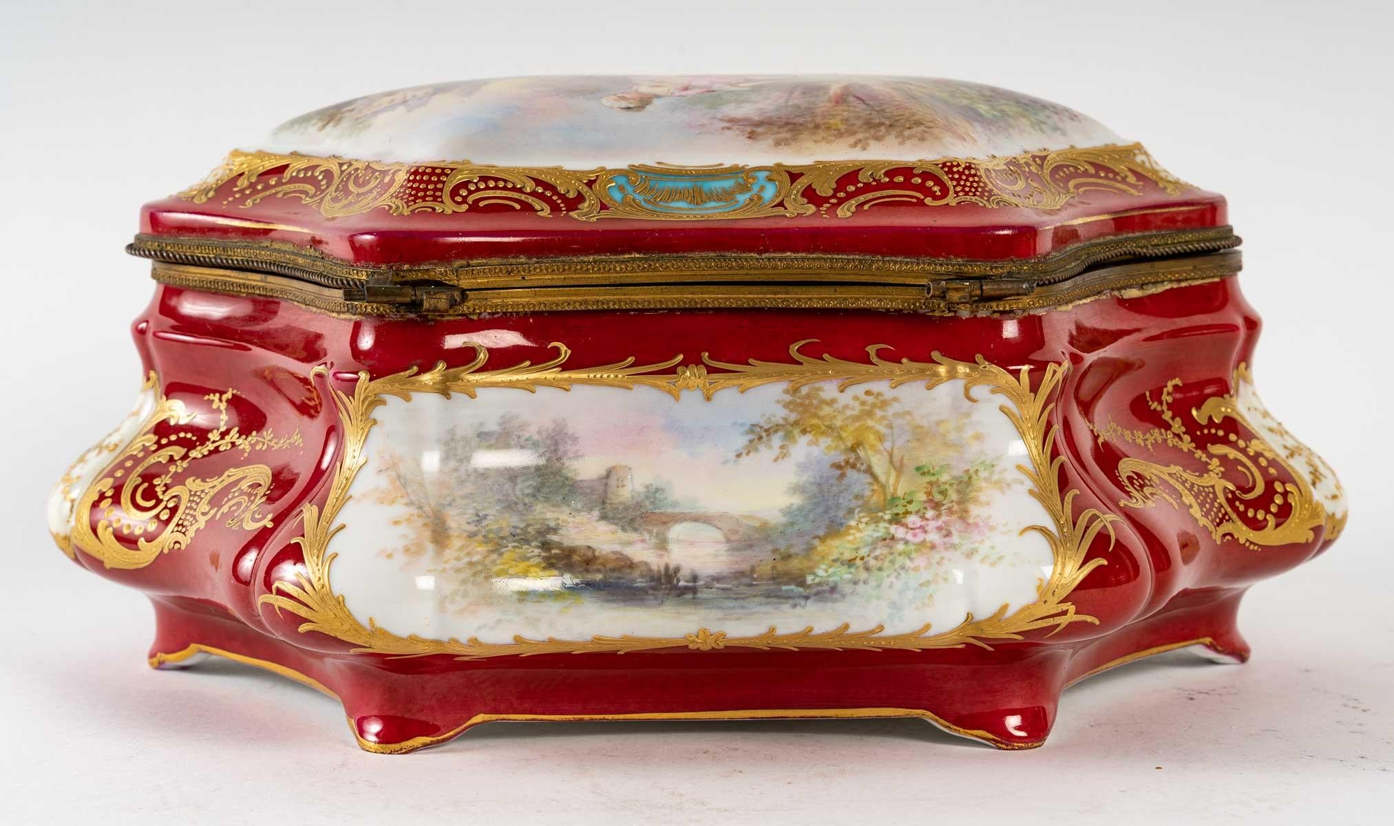 A beautiful red, turquoise and white porcelain box with a scene of a gallant couple, signed Sèvres, château des Tuileries, 19th century, Napoleon III period.
 