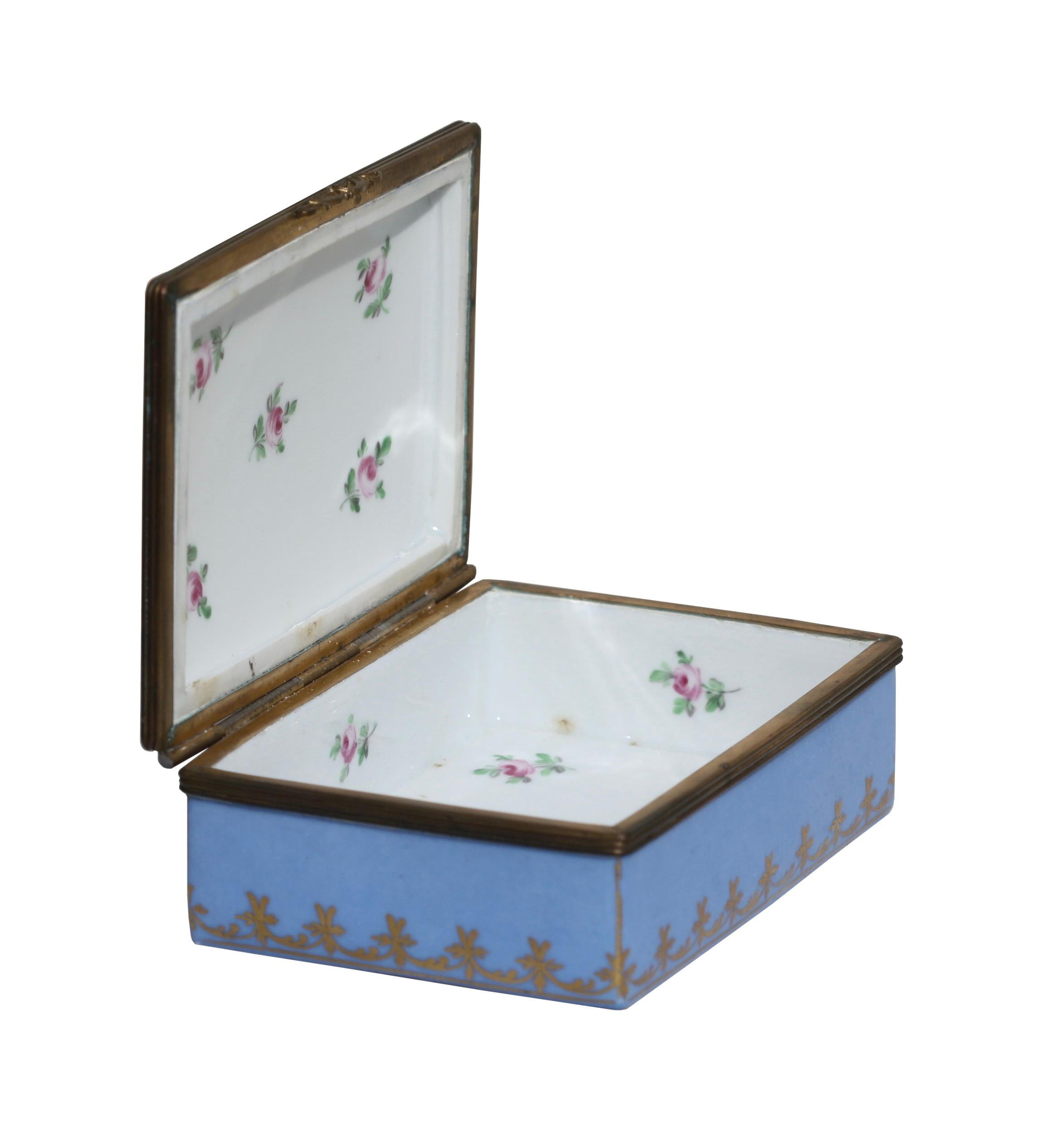 Porcelain box, English, late 19th century
The rectangular hinged cover painted with a figural panel and inscribed 