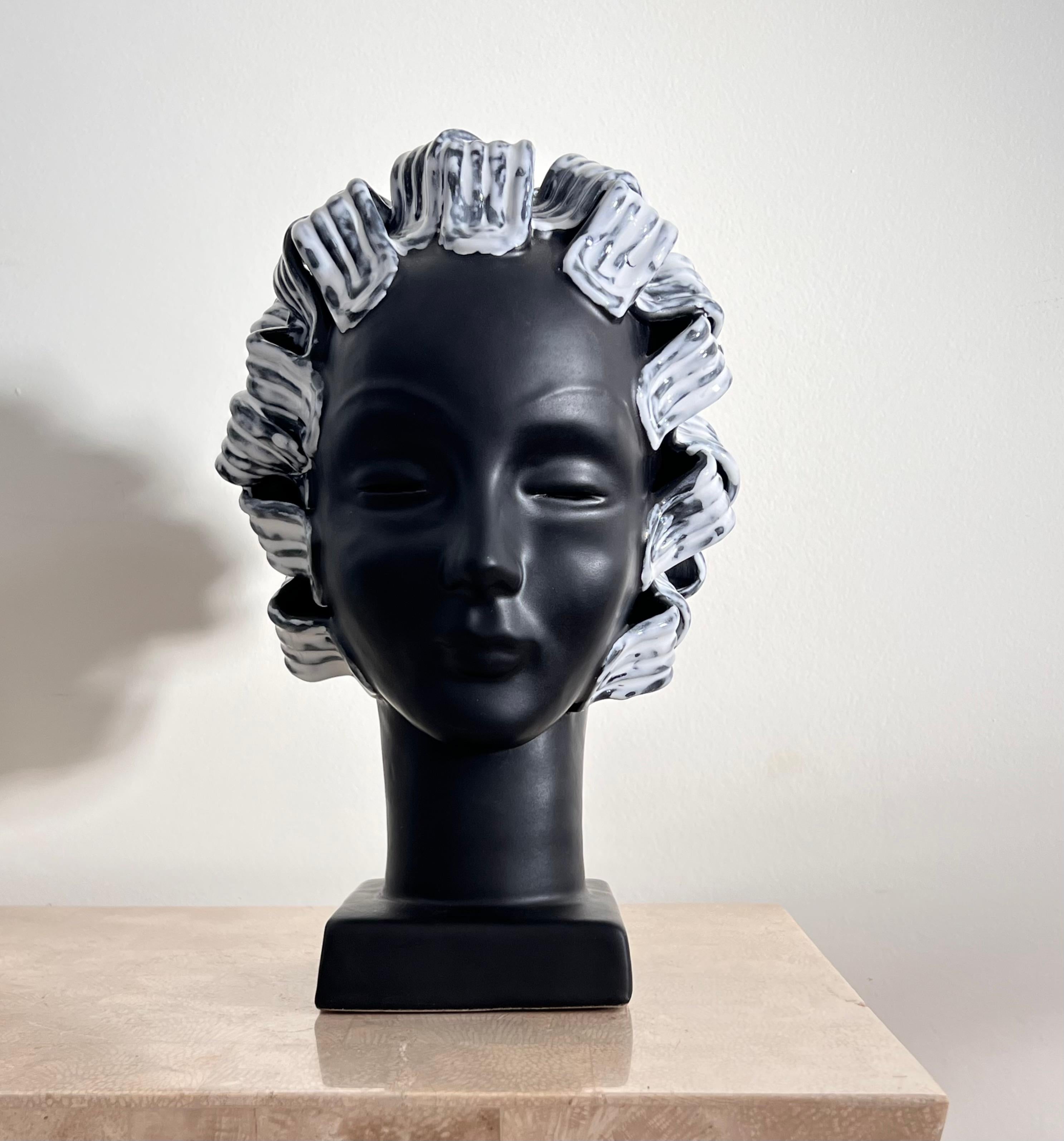 The porcelain bust of a woman, late 20th century. Featuring ribbon-like hair of glazed ceramic - reminiscent of a contemporary vision of Medusa. Minor signs of age shown in photos. 

7” W x 8” D x 11.75” H.