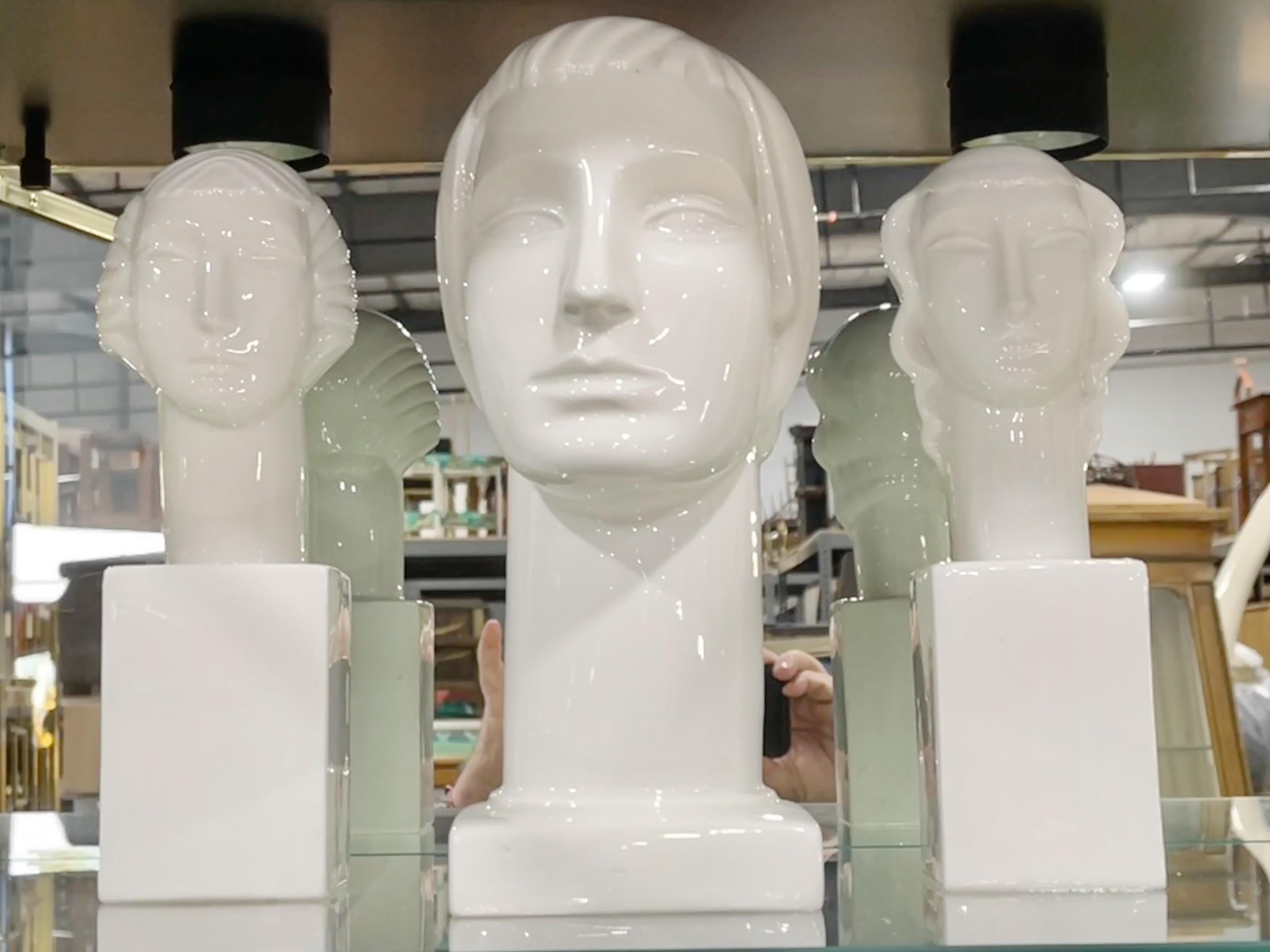 Grouping of three works designed in the early 1930's by Geza de Vegh for Lamberton Scammell china works of Trenton, NJ.
One large male bust 15 inches high and a male/female pair of heads on integral elongated square column 12 inches high.
All