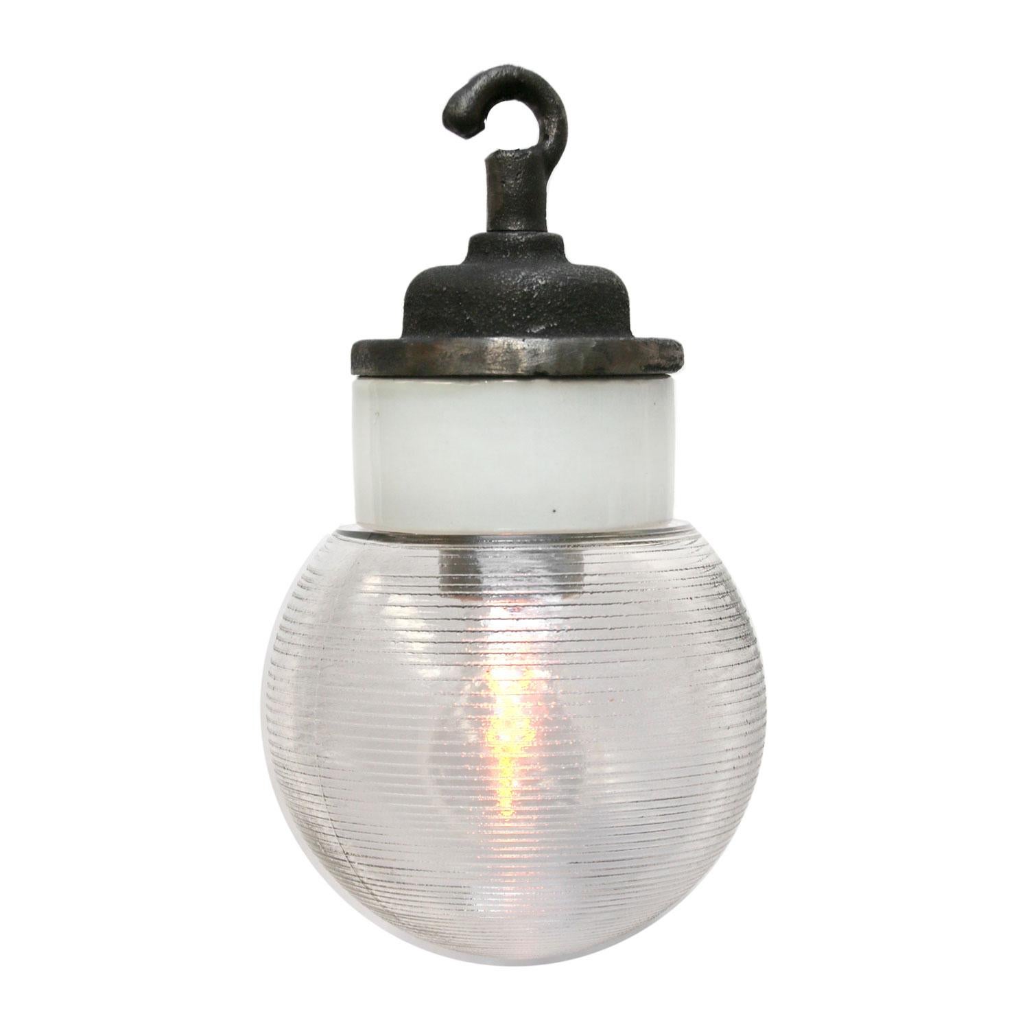 Porcelain Industrial hanging lamp.
White porcelain, cast iron and clear Holophane glass.
2 conductors, no ground.

Weight: 1.50 kg / 3.3 lb

Priced per individual item. All lamps have been made suitable by international standards for